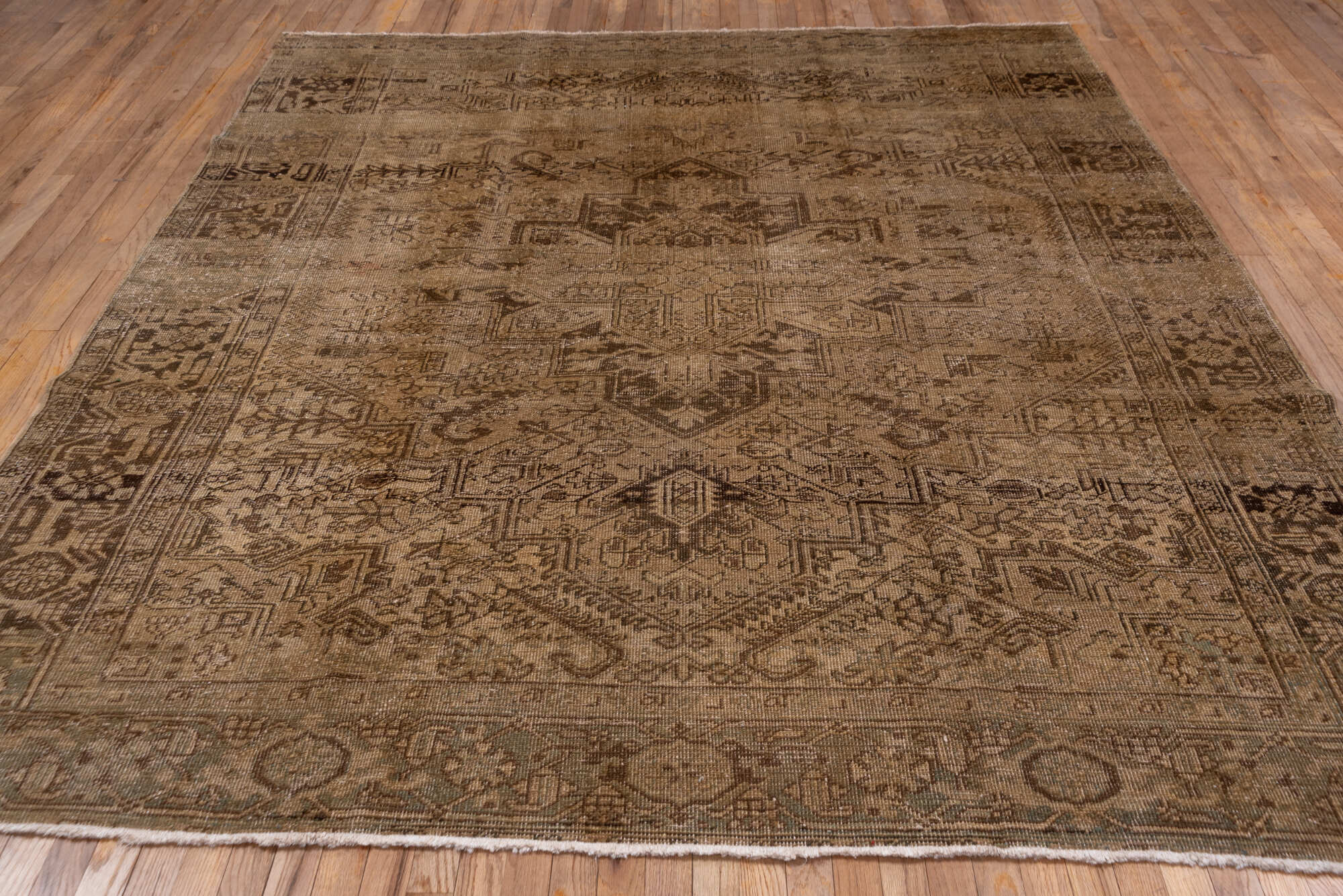 7' x 9' one-of-a-kind handmade vintage Heriz rug. Color palette: brown, light gray, gray, off-white, orange, pink, black