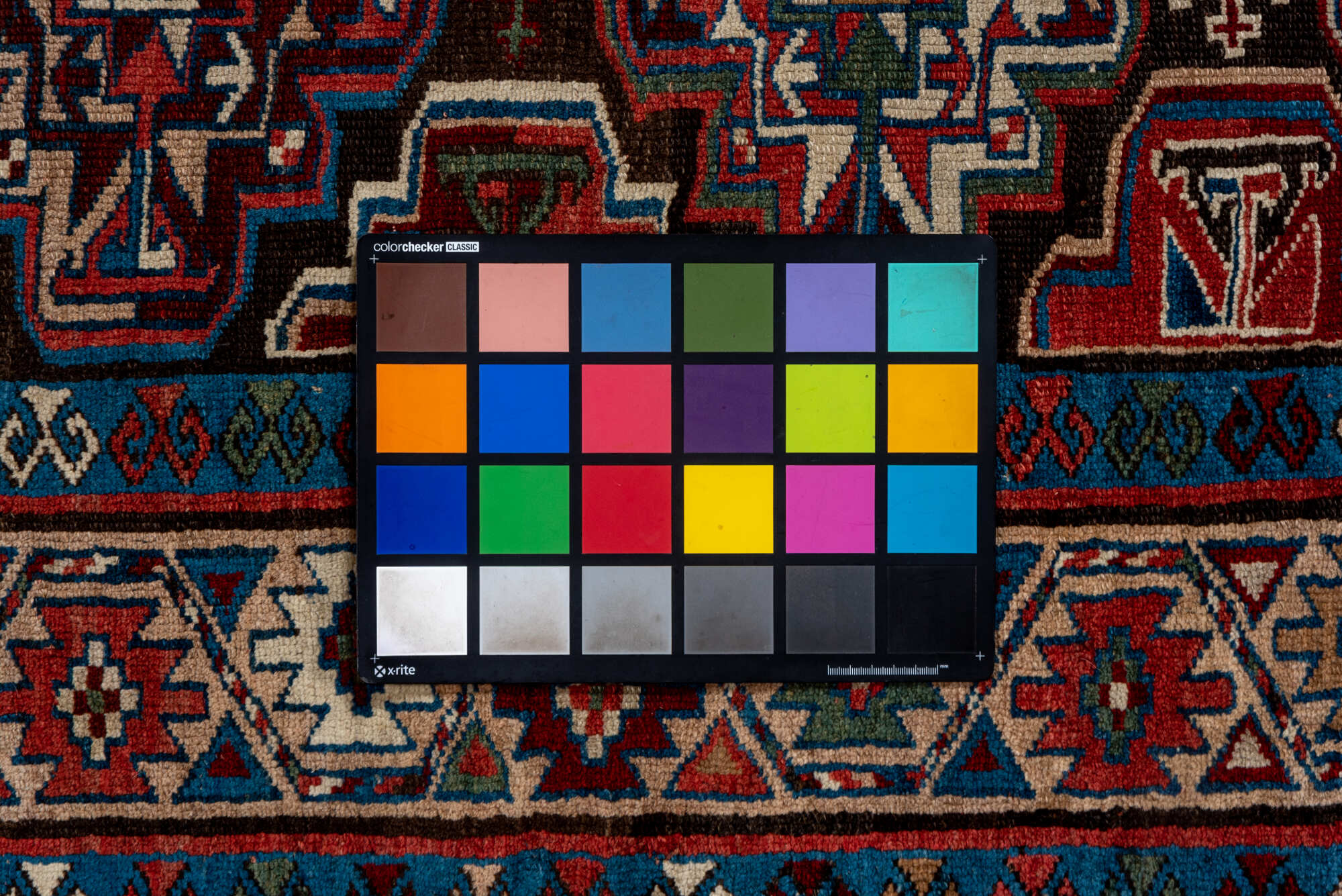 3' x 10' one-of-a-kind handmade vintage Kurd runner rug. Color palette: black, blue, brown, gray, pink, red