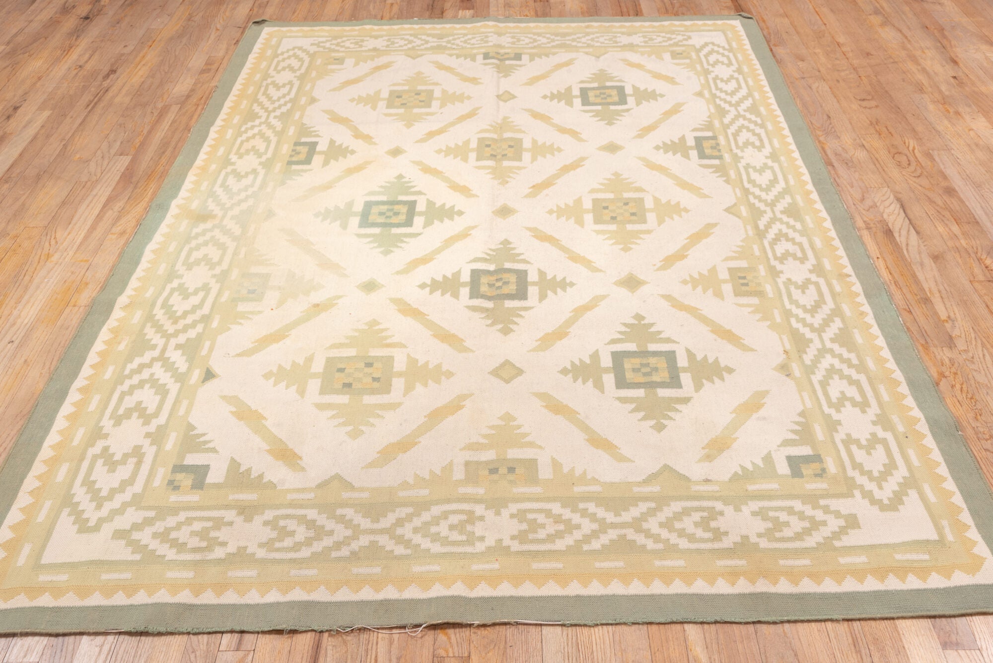 6' x 9' one-of-a-kind handmade vintage Dhurrie medium size rug. Color palette: brown, gray, light gray, off-white, orange