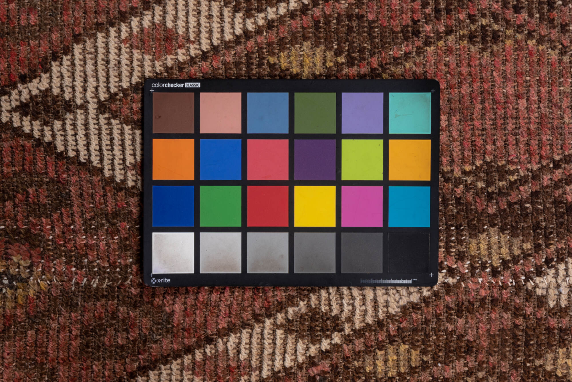 4' x 12' one-of-a-kind handmade vintage Ouzbek runner rug. Color palette: brown, pink, redwood