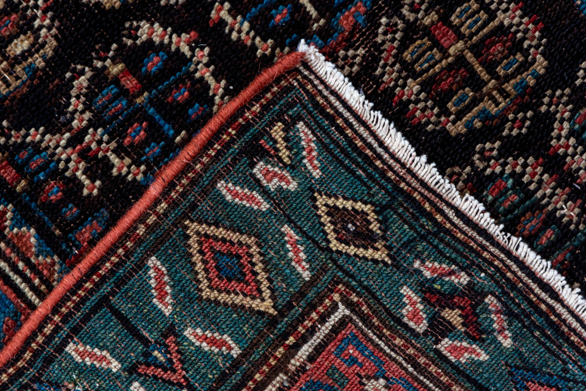 2' x 12' one-of-a-kind handmade vintage Caucasian runner rug. Color palette: black, brown, charcoal, gray, off-white, pink