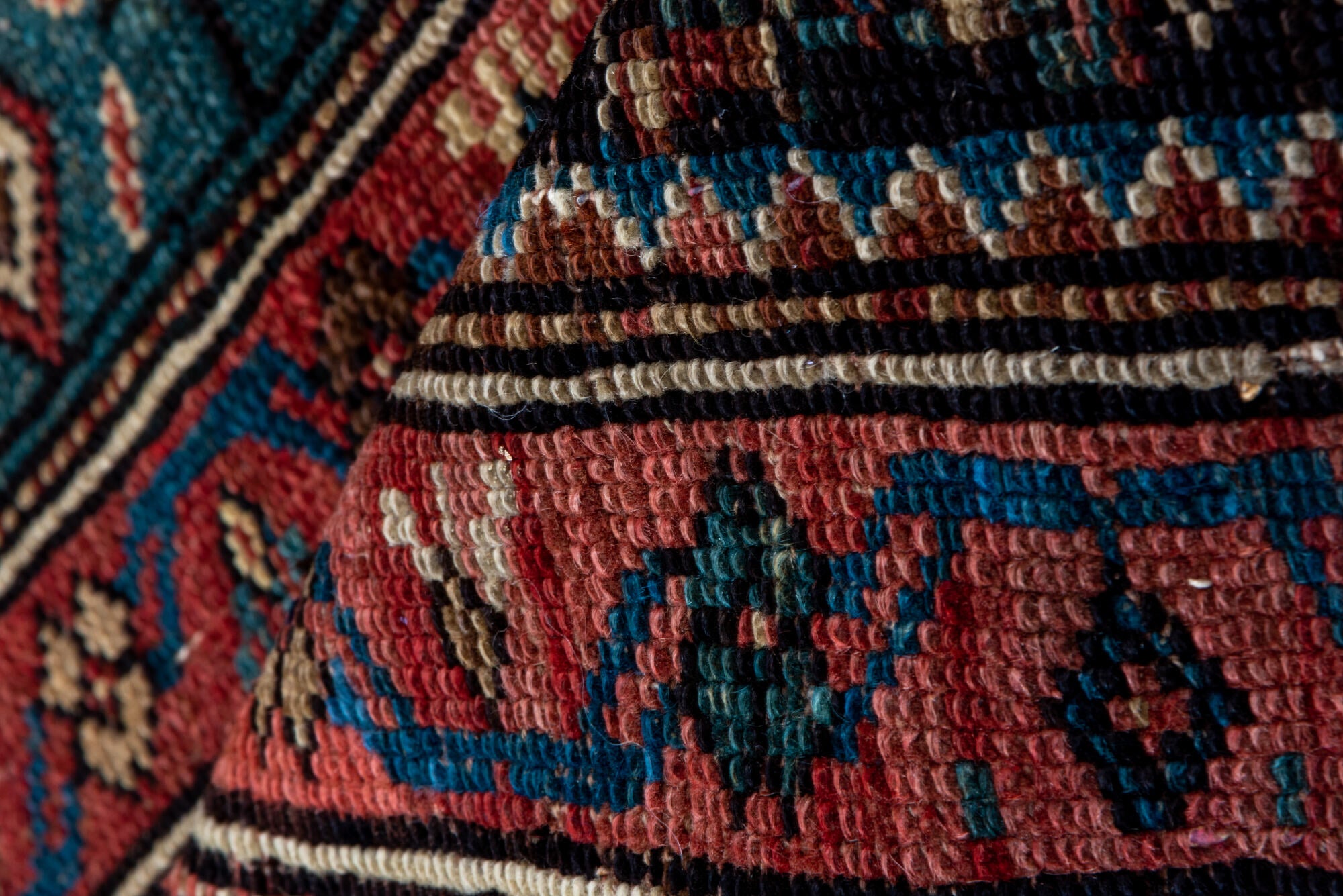 2' x 12' one-of-a-kind handmade vintage Caucasian runner rug. Color palette: black, brown, charcoal, gray, off-white, pink