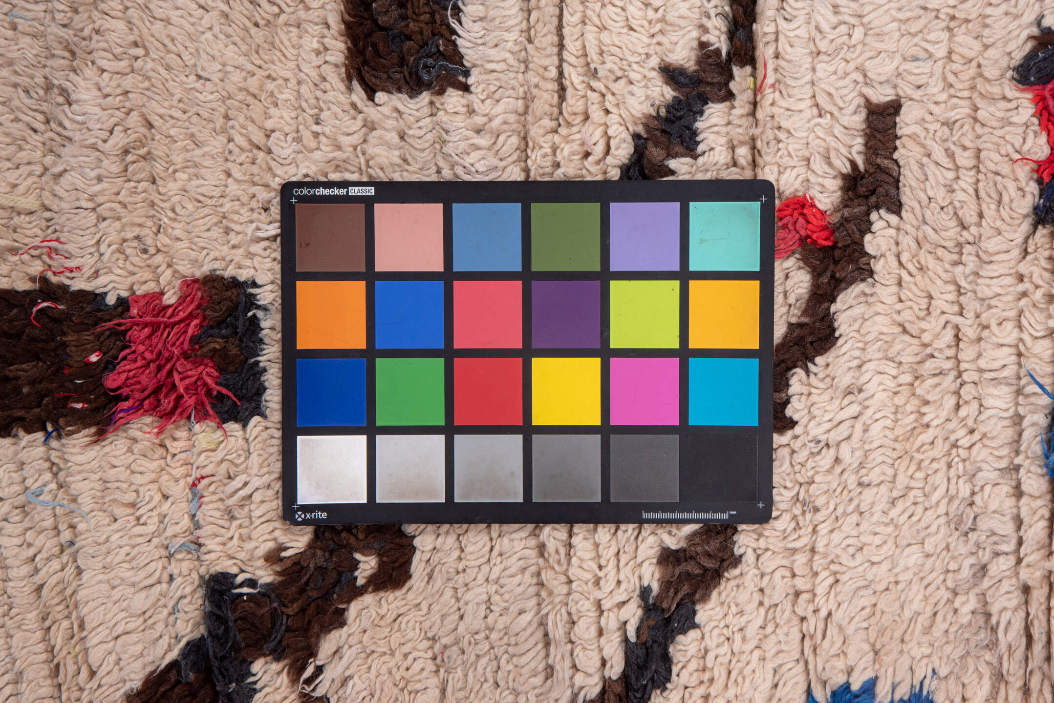 4' x 6' one-of-a-kind handmade vintage Moroccan small size rug. Color palette: brown, red, pink, light gray, off-white, gray