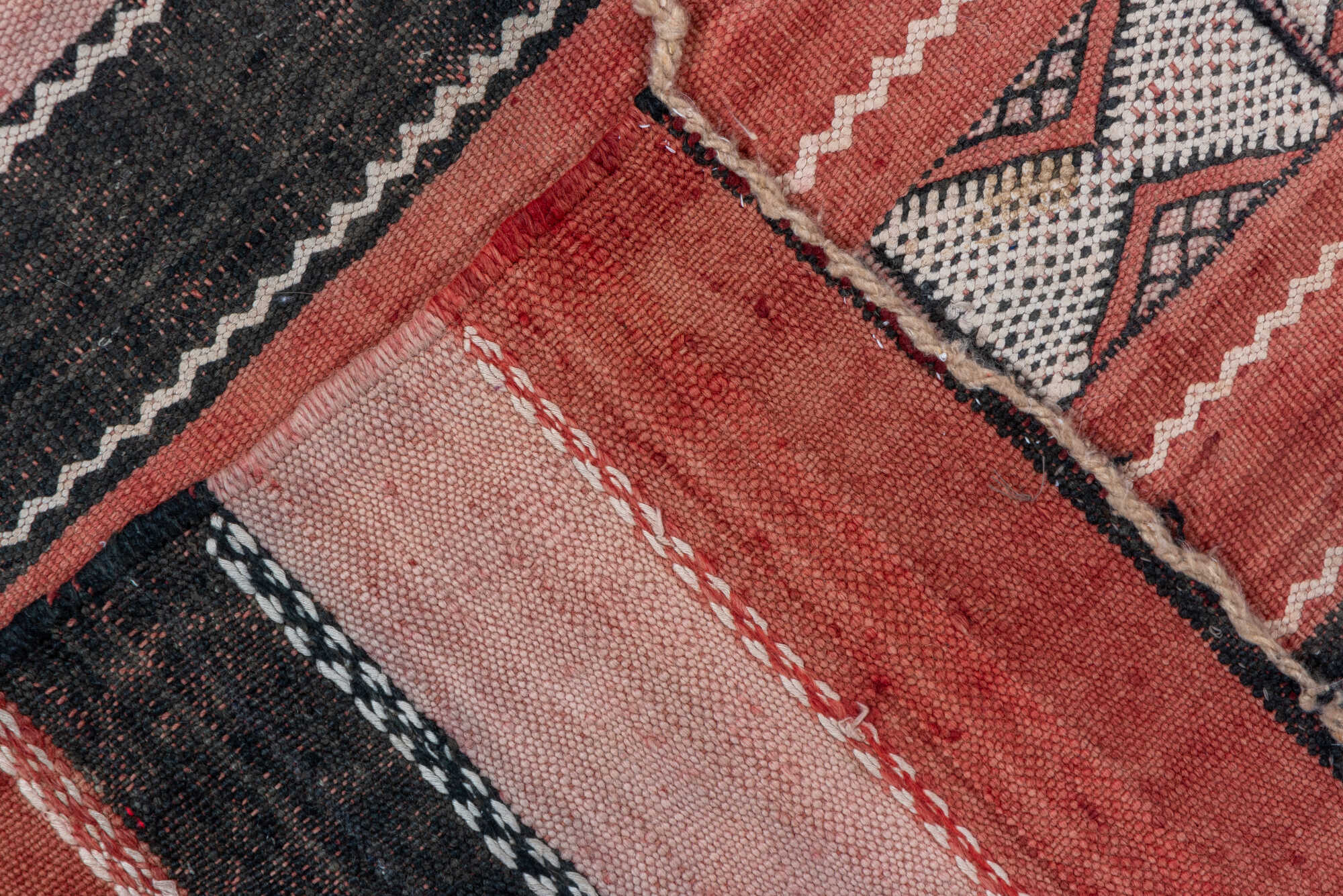 5' x 8' one-of-a-kind handmade vintage Jijim medium size rug. Color palette: black, brown, gray, light gray, orange, pink