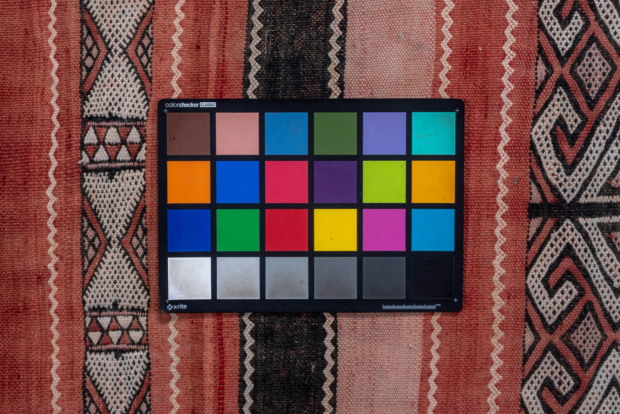 5' x 8' one-of-a-kind handmade vintage Jijim medium size rug. Color palette: black, brown, gray, light gray, orange, pink