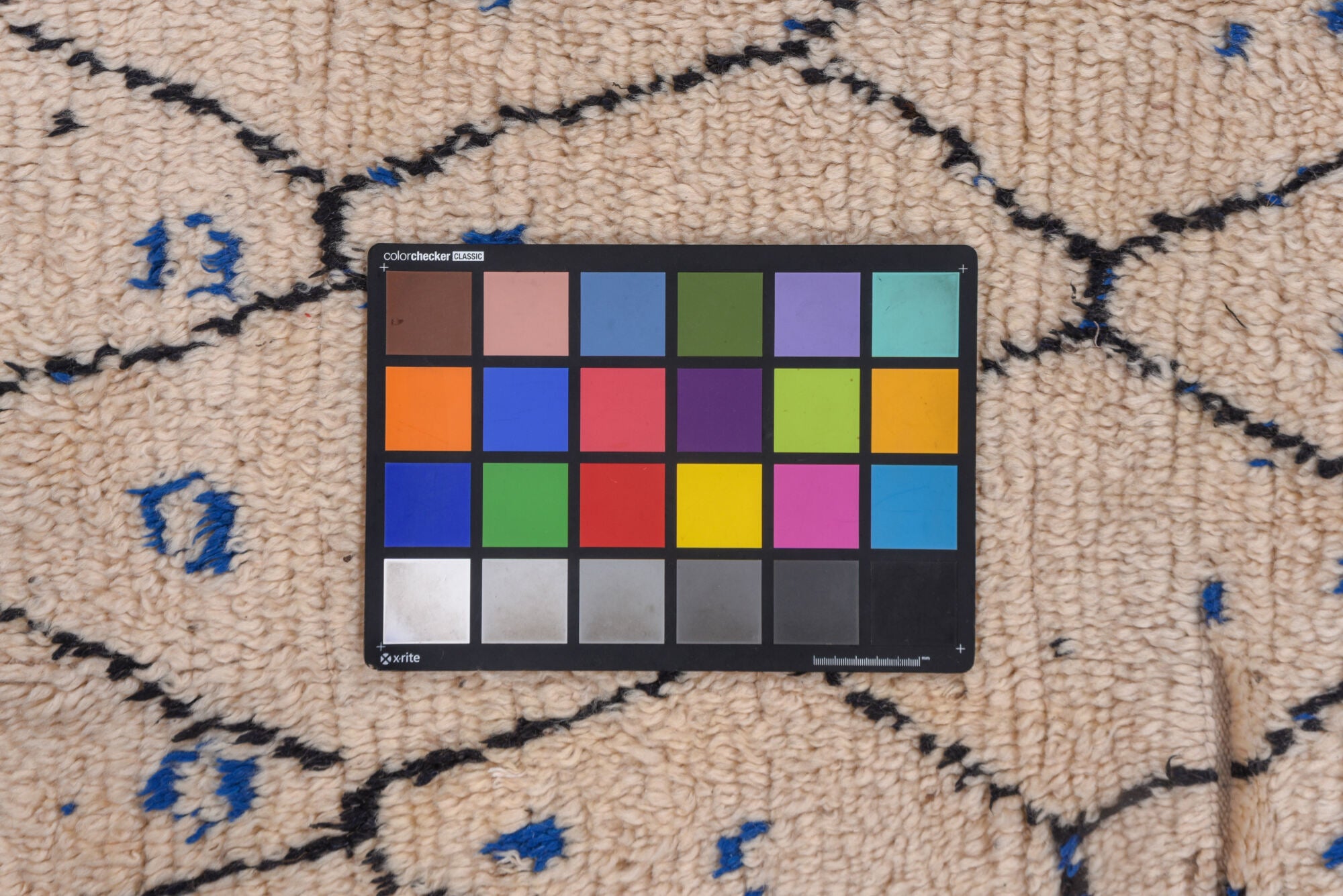 4' x 9' one-of-a-kind handmade vintage Moroccan runner rug. Color palette: black, blue, brown, charcoal, gray, light gray