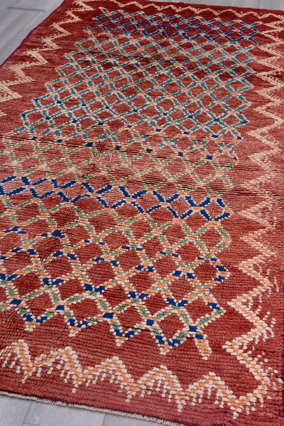 4' x 11' one-of-a-kind handmade vintage Moroccan runner rug. Color palette: pink, red, gray, light gray, brown, off-white