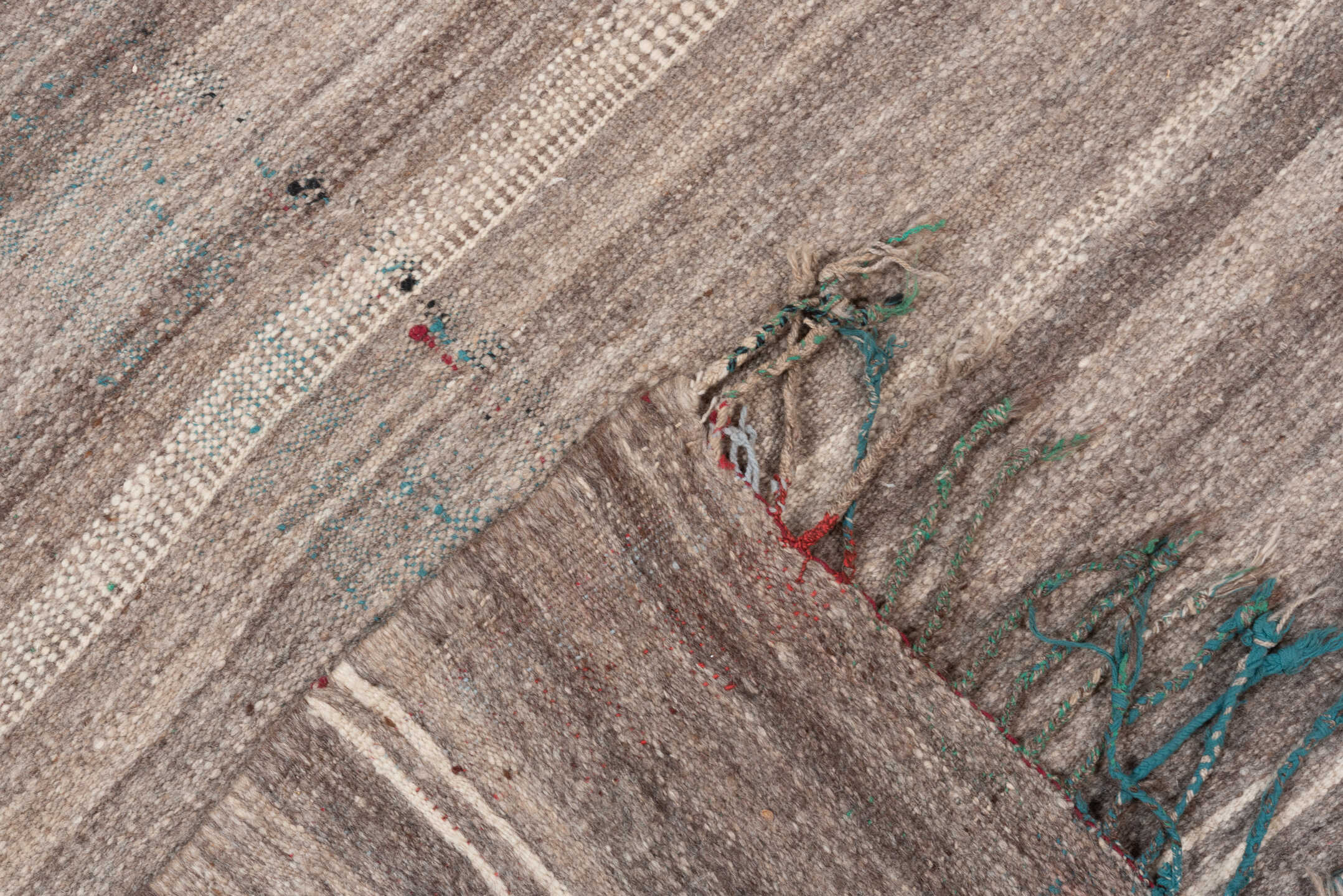 4' x 10' one-of-a-kind handmade vintage  runner rug. Color palette: gray, brown, pink, light gray, off-white