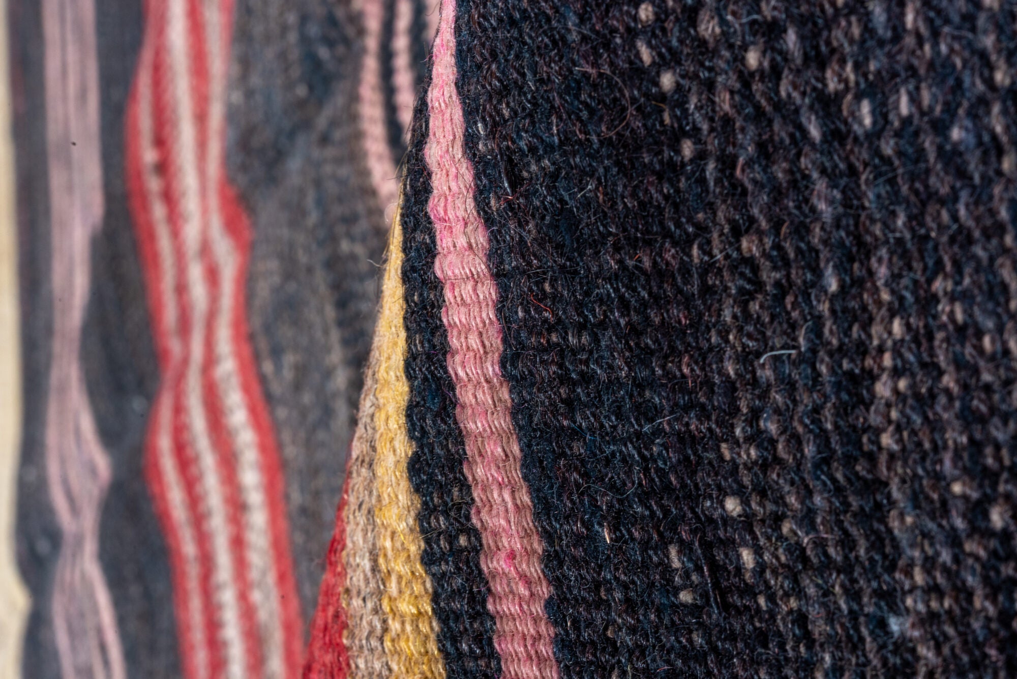 4' x 11' one-of-a-kind handmade vintage Kilim runner rug. Color palette: black, brown, charcoal, gray, pink, red