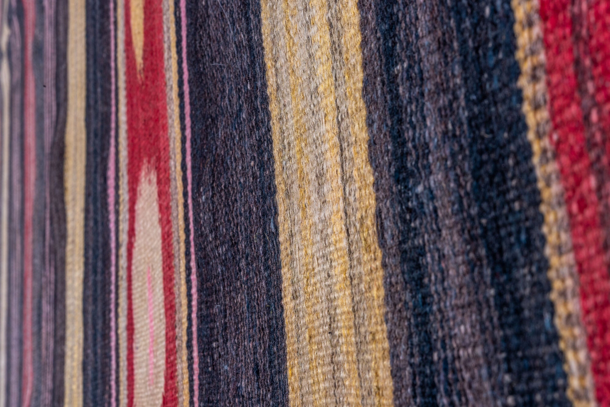 4' x 11' one-of-a-kind handmade vintage Kilim runner rug. Color palette: black, brown, charcoal, gray, pink, red