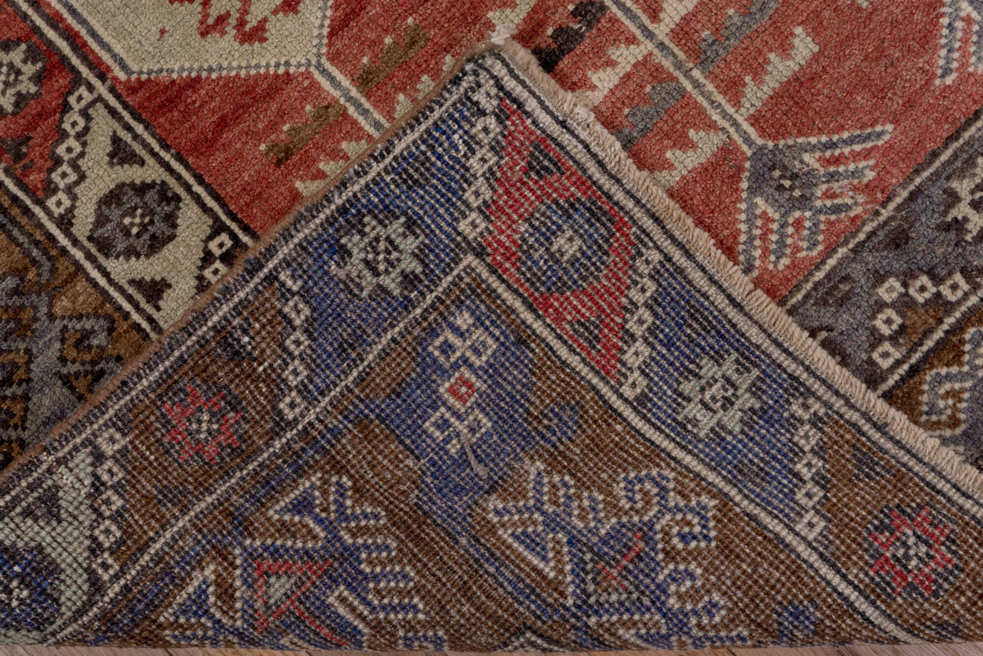 4' x 8' one-of-a-kind handmade vintage Konya runner rug. Color palette: brown, gray, pink, red