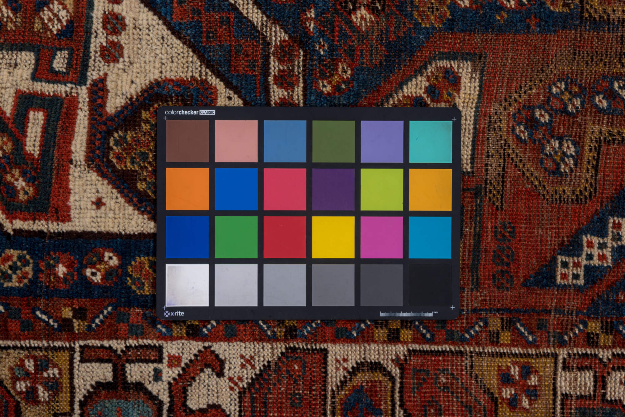 7' x 9' one-of-a-kind handmade vintage Shiraz rug. Color palette: gray, pink, brown, light gray, off-white, black, red, blue