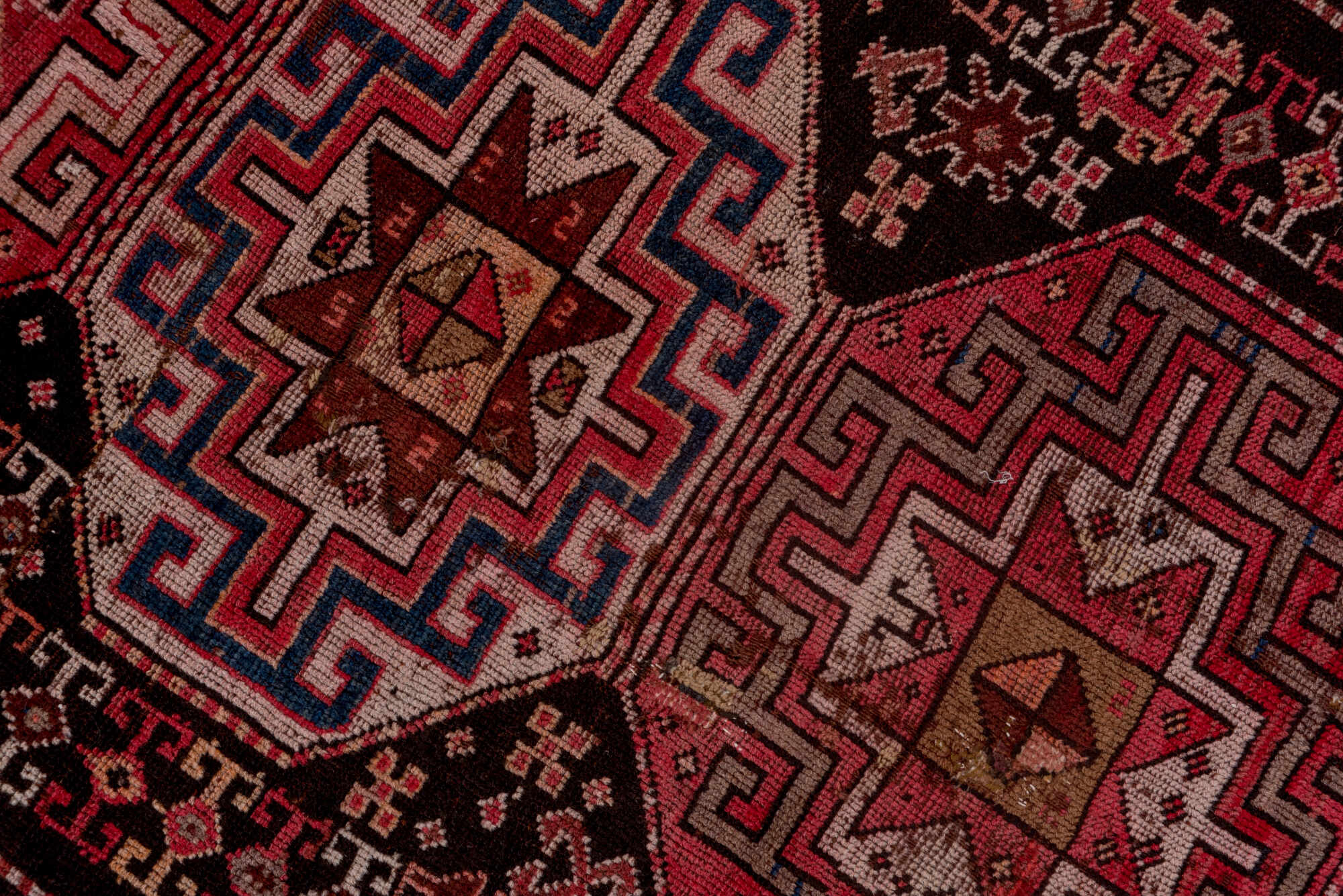 4' x 9' one-of-a-kind handmade vintage Kazak runner rug. Color palette: brown, gray, pink, red, rosy brown
