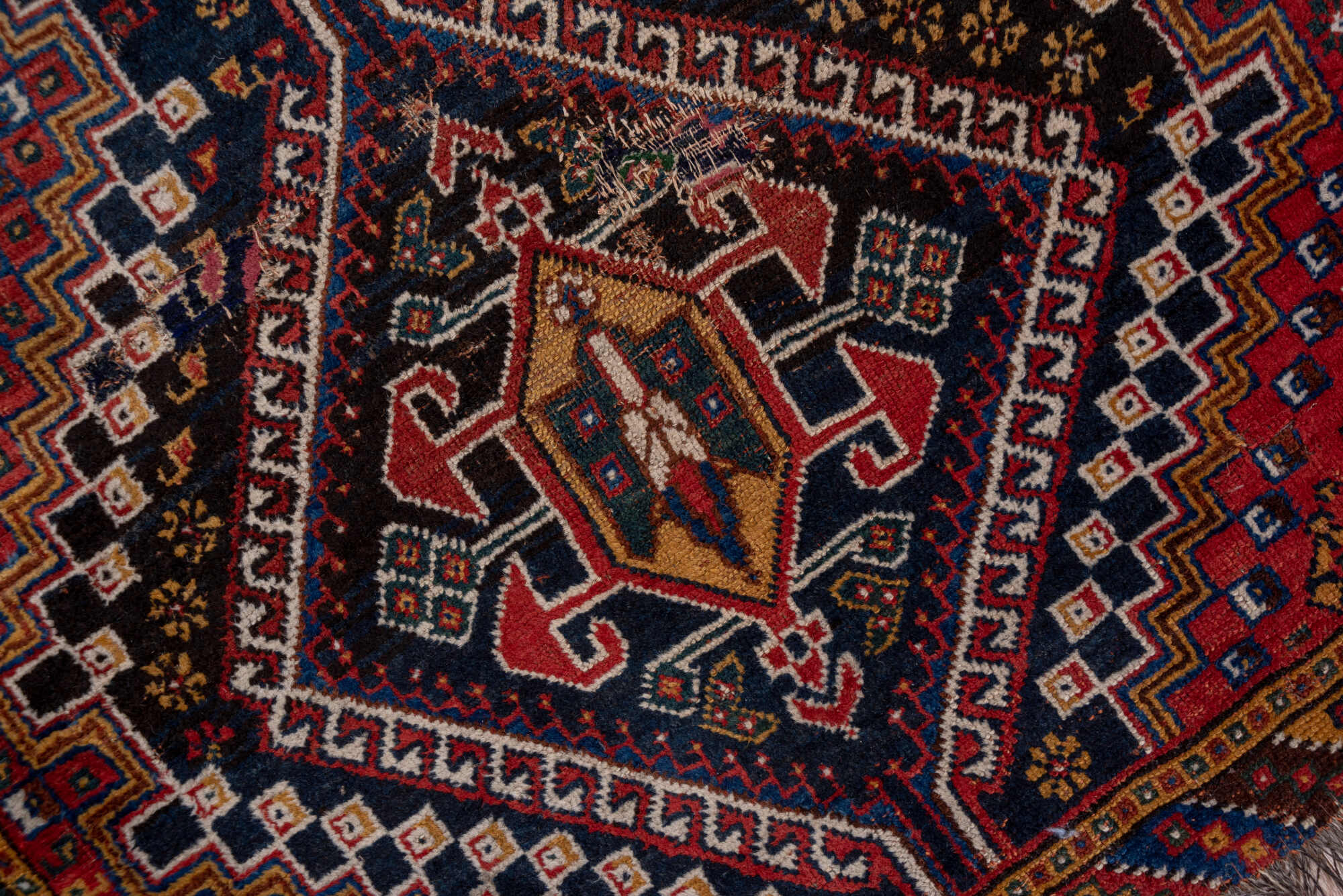 3' x 9' one-of-a-kind handmade vintage Shiraz runner rug. Color palette: black, blue, brown, fiord, gray, pink, red