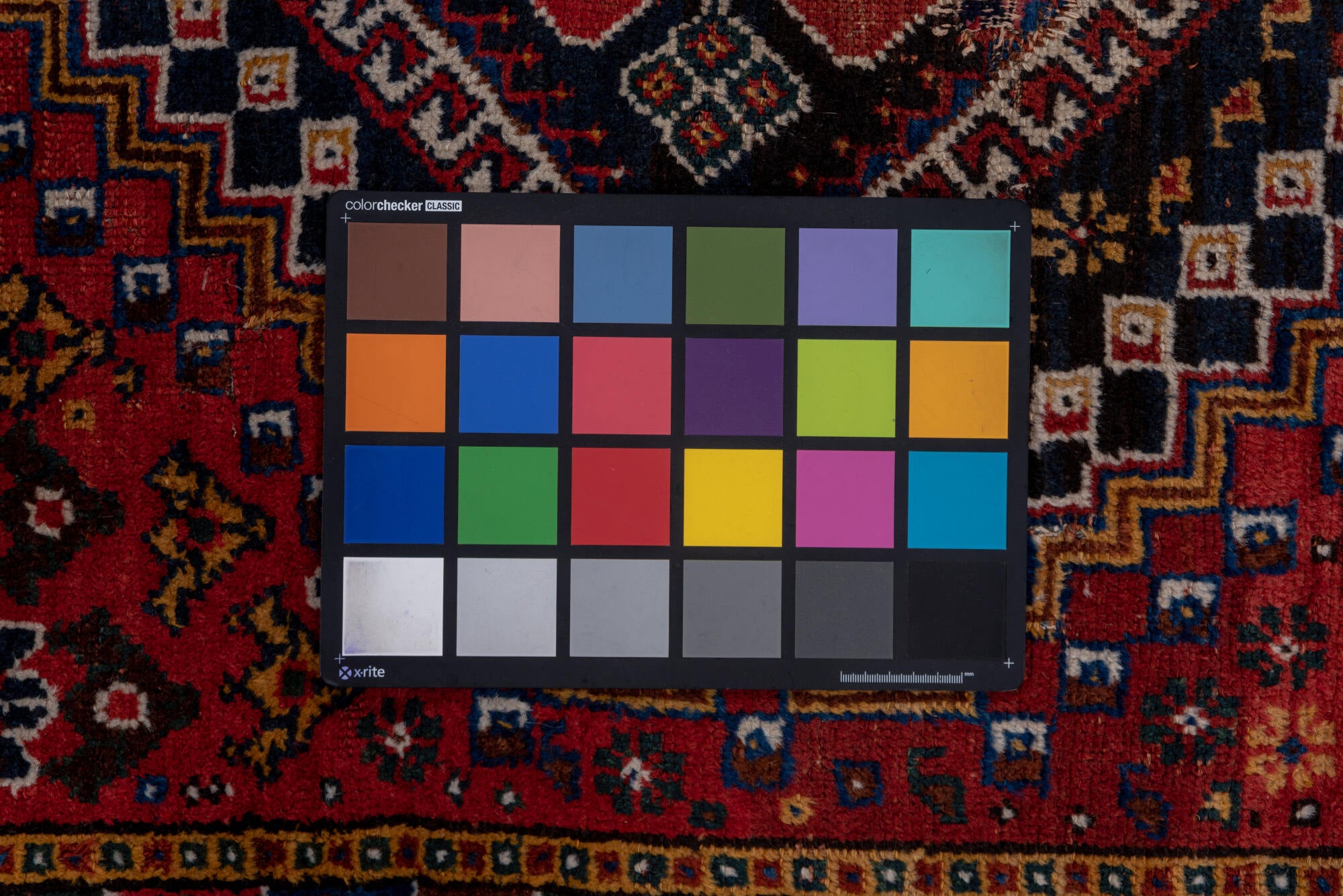 3' x 9' one-of-a-kind handmade vintage Shiraz runner rug. Color palette: black, blue, brown, fiord, gray, pink, red