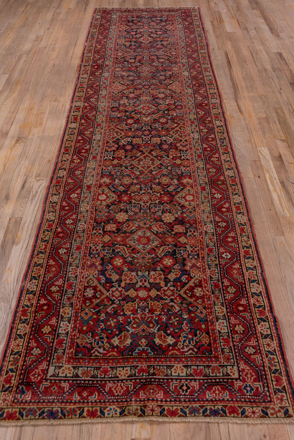 3' x 12' one-of-a-kind handmade vintage Malayer runner rug. Color palette: pink, red, brown, gray, orange