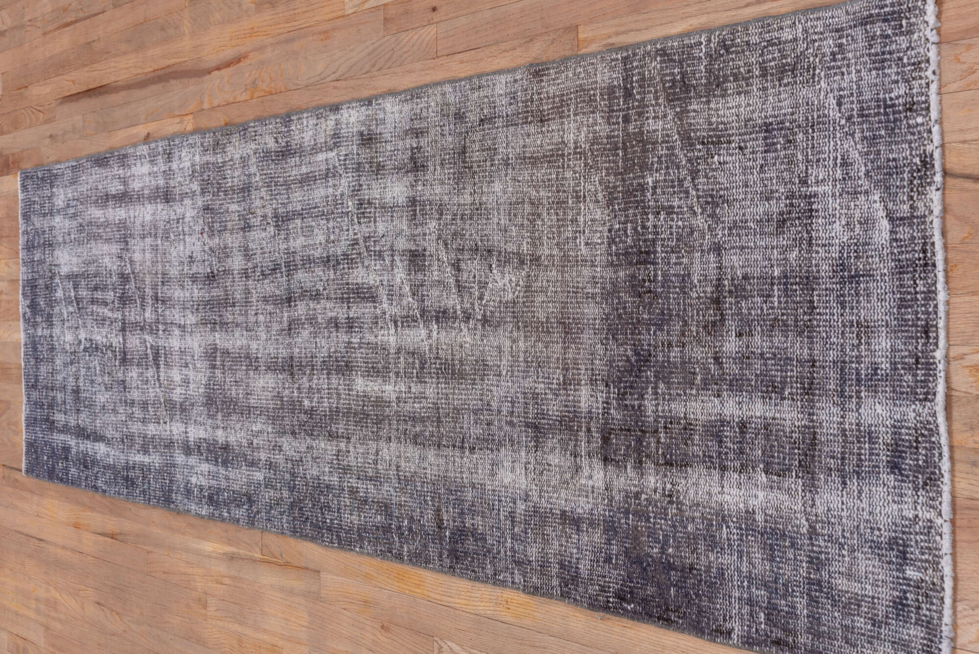 2' x 9' one-of-a-kind handmade vintage Overdyed runner rug. Color palette: black, gainsboro, gray, light gray, off-white