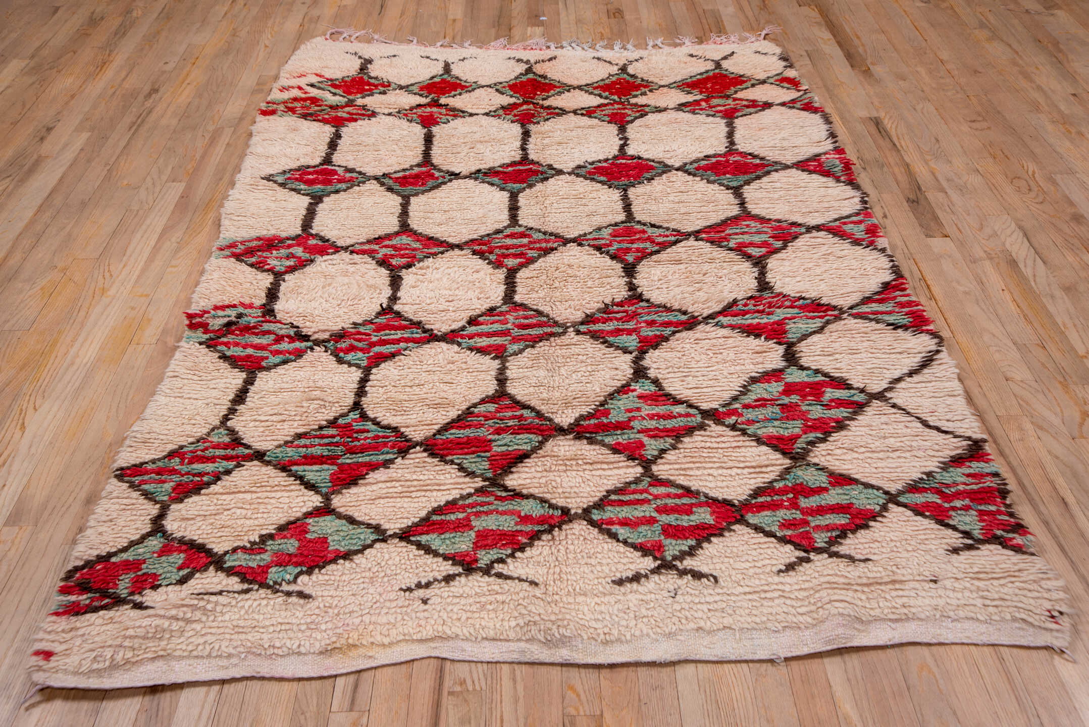 5' x 8' one-of-a-kind handmade vintage Moroccan medium size rug. Color palette: pink, gray, red, brown, off-white, orange