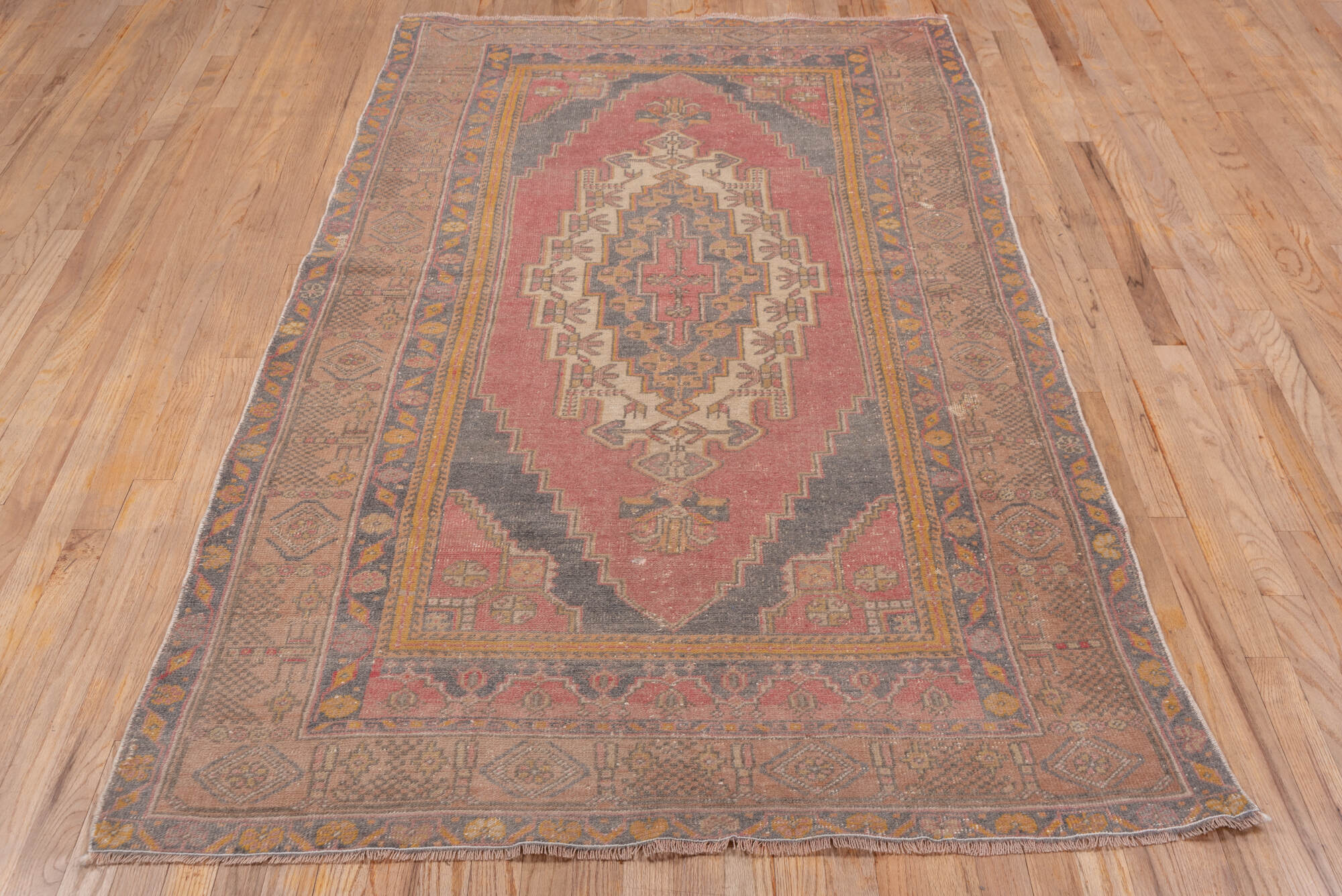 4' x 7' one-of-a-kind handmade vintage Oushak rug. Color palette: brown, gray, light gray, off-white, orange, pink