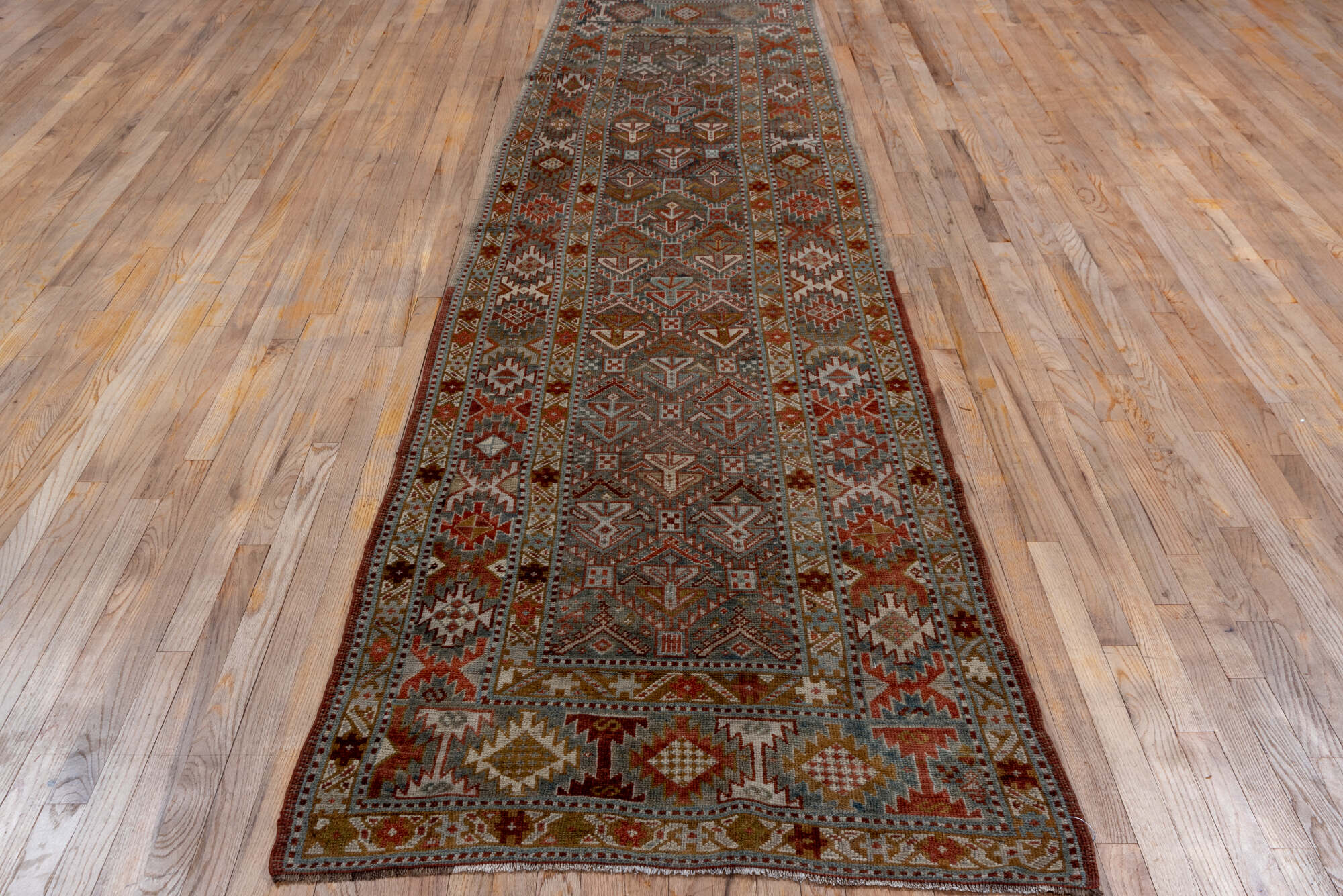 3' x 12' one-of-a-kind handmade vintage NW Persian runner rug. Color palette: black, brown, gray, pink, red