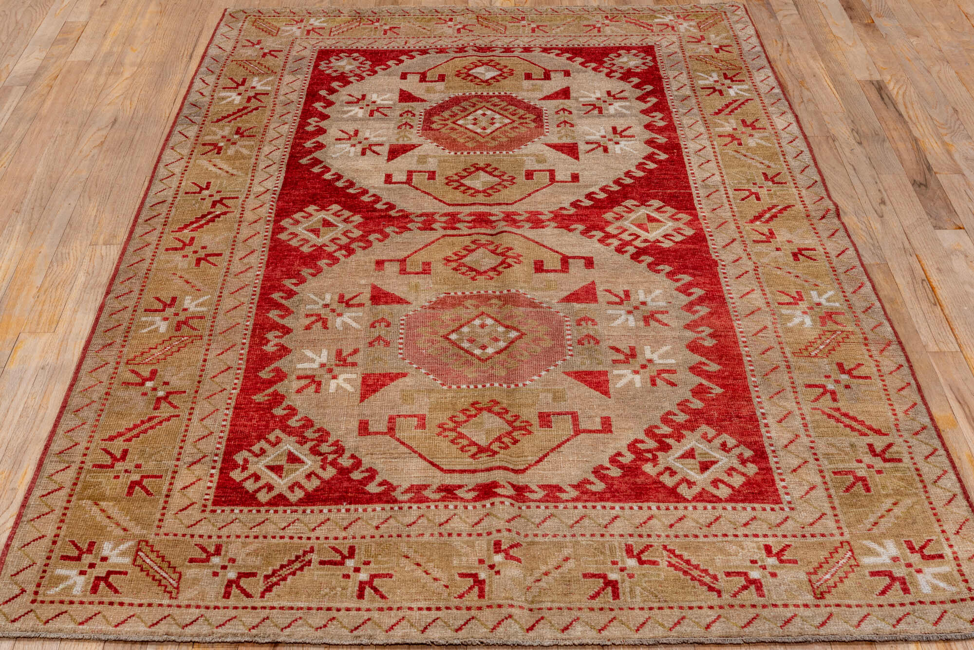 4' x 7' one-of-a-kind handmade vintage Caucasian rug. Color palette: brown, gray, light gray, off-white, pink, red