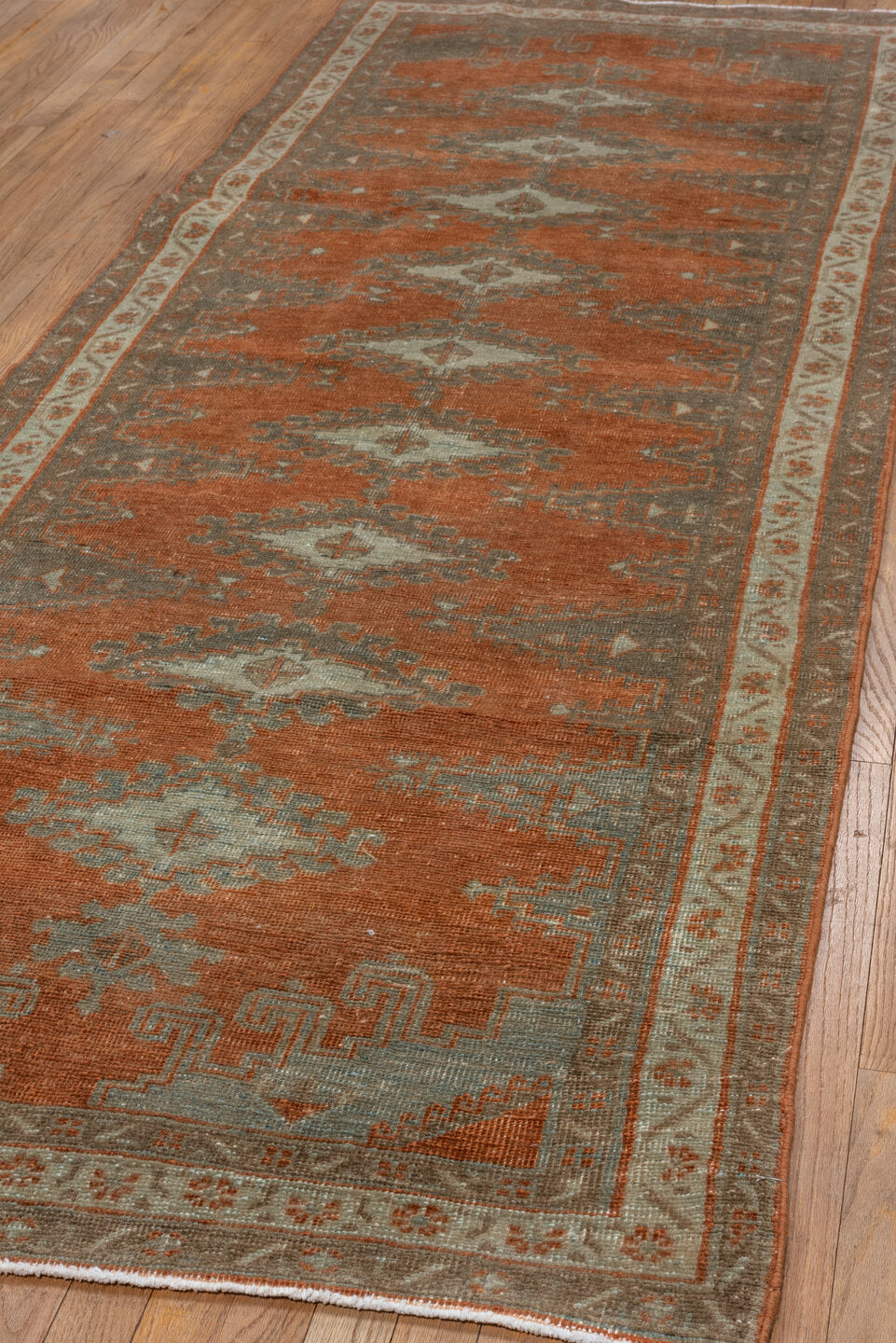 3' x 10' one-of-a-kind handmade vintage Veece runner rug. Color palette: brown, pink, gray, light gray, off-white, sienna
