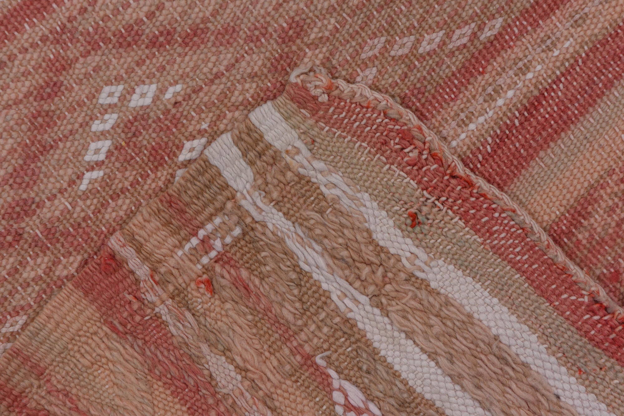 4' x 10' one-of-a-kind handmade vintage Moroccan runner rug. Color palette: brown, gray, light gray, off-white, pink, red