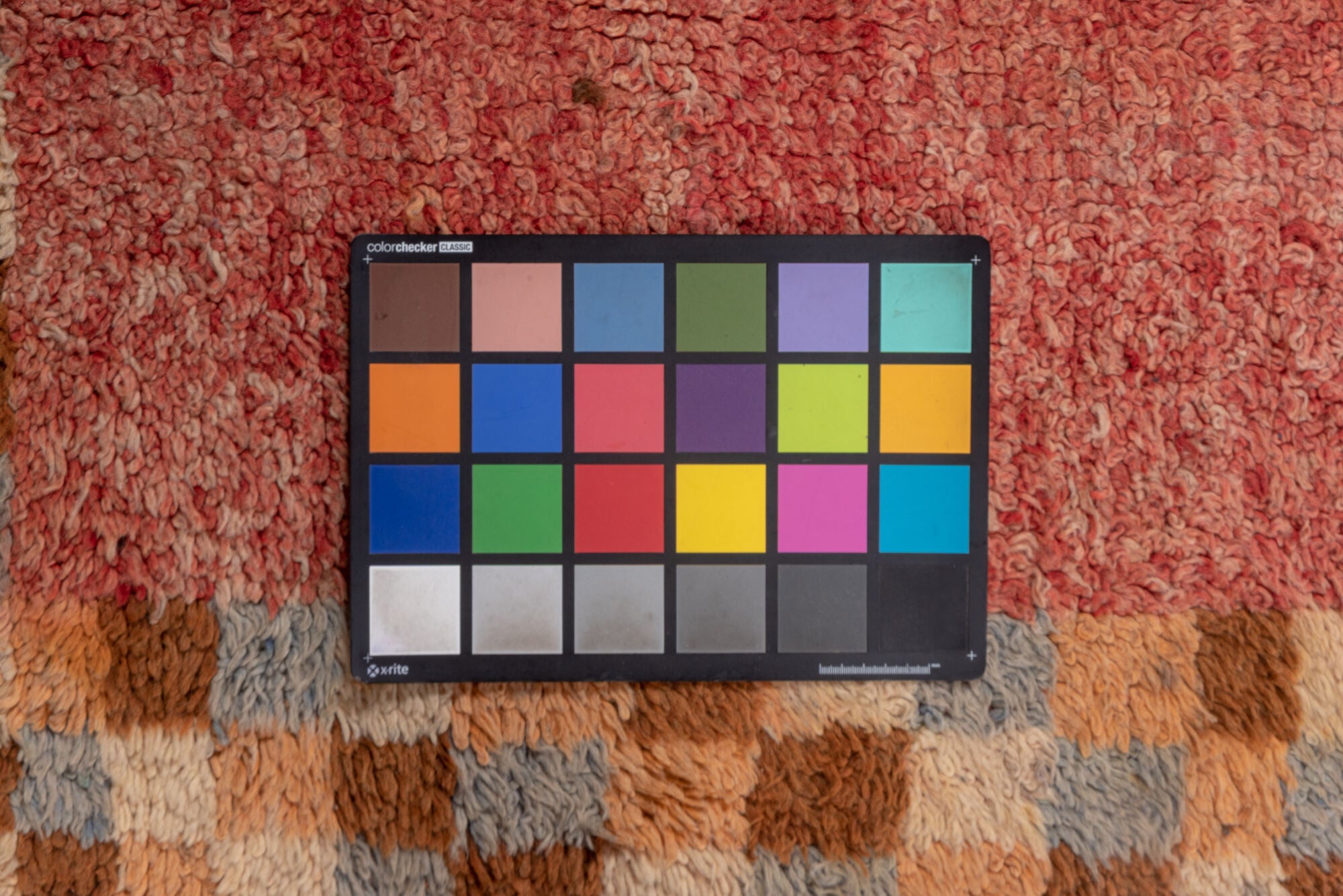 3' x 9' one-of-a-kind handmade vintage Moroccan runner rug. Color palette: brown, orange, pink, red