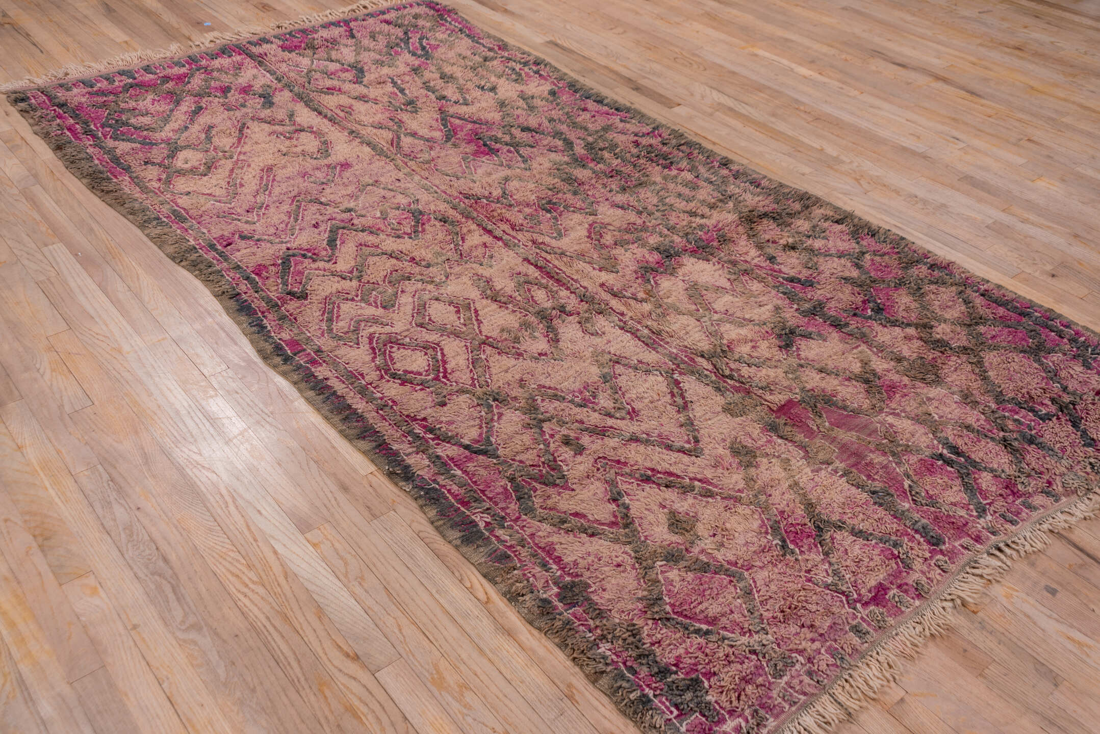5' x 10' one-of-a-kind handmade vintage Moroccan medium size rug. Color palette: gray, pink, light gray, off-white, brown