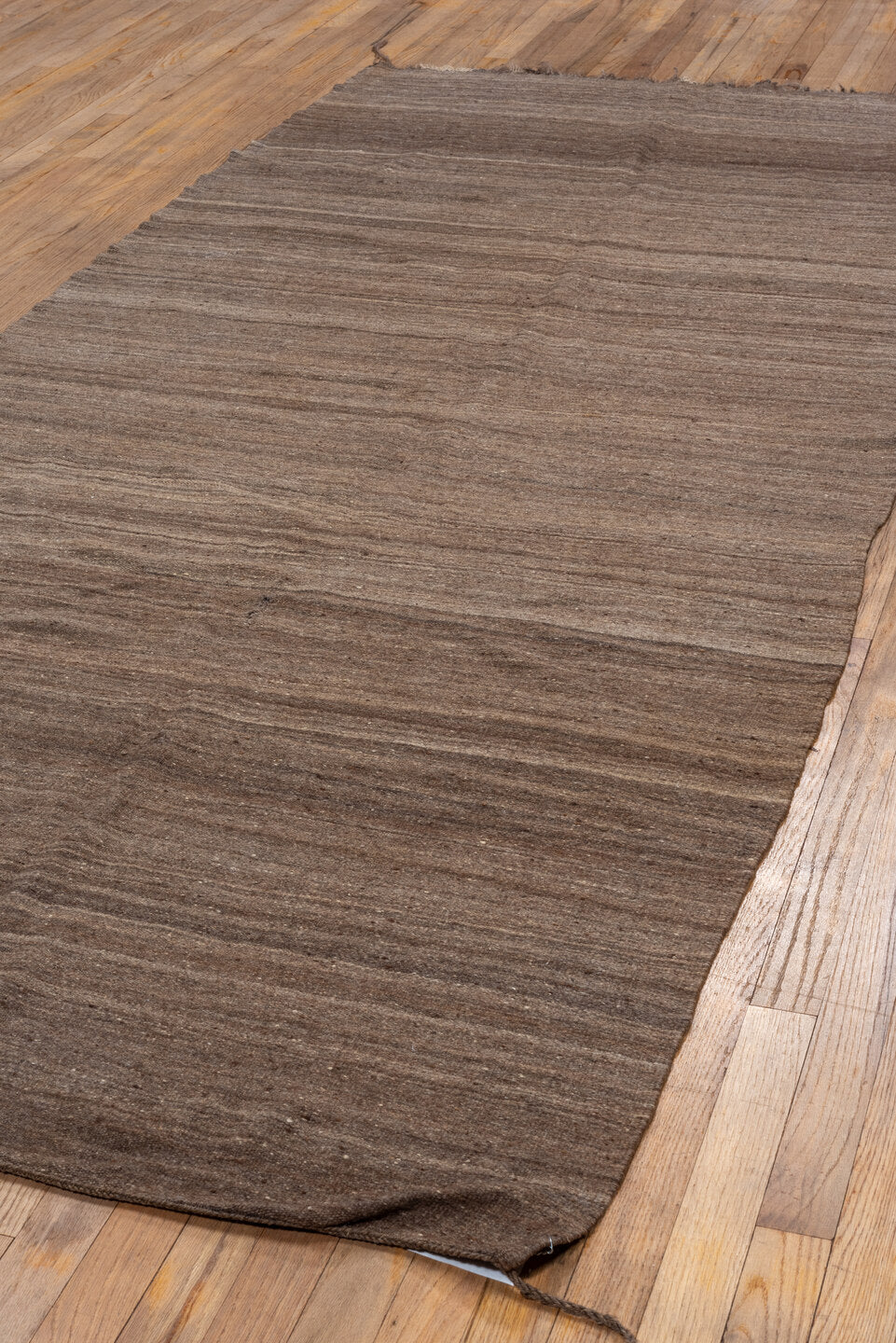 4' x 9' one-of-a-kind handmade vintage  runner rug. Color palette: brown, gray, light gray, off-white, pink, snow, white