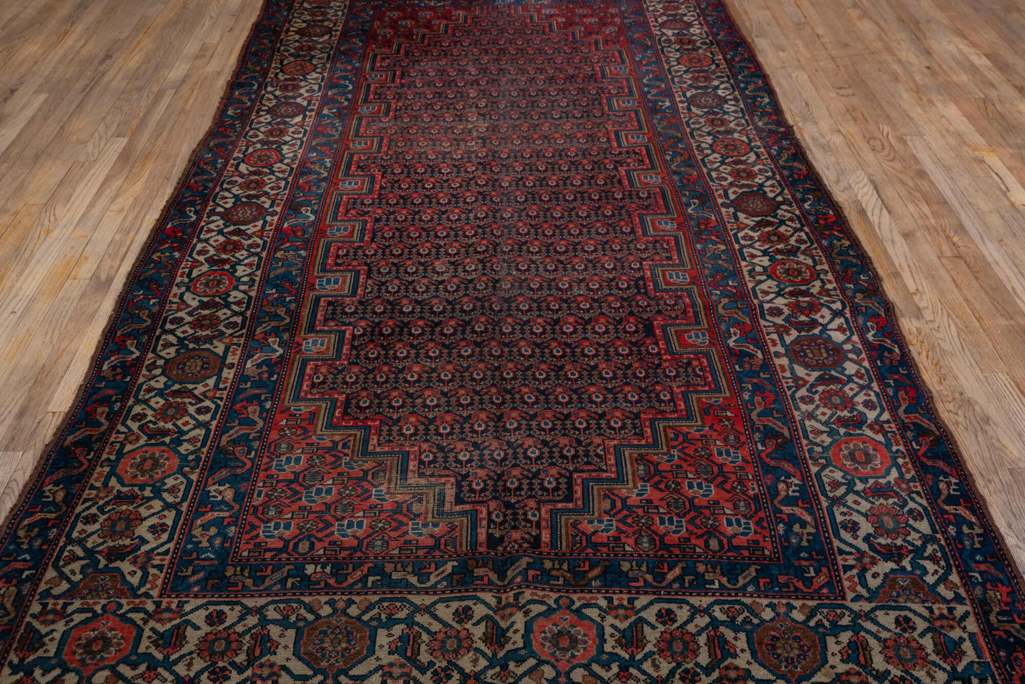 5' x 11' one-of-a-kind handmade vintage Malayer rug. Color palette: black, blue, brown, charcoal, gray, pink, red