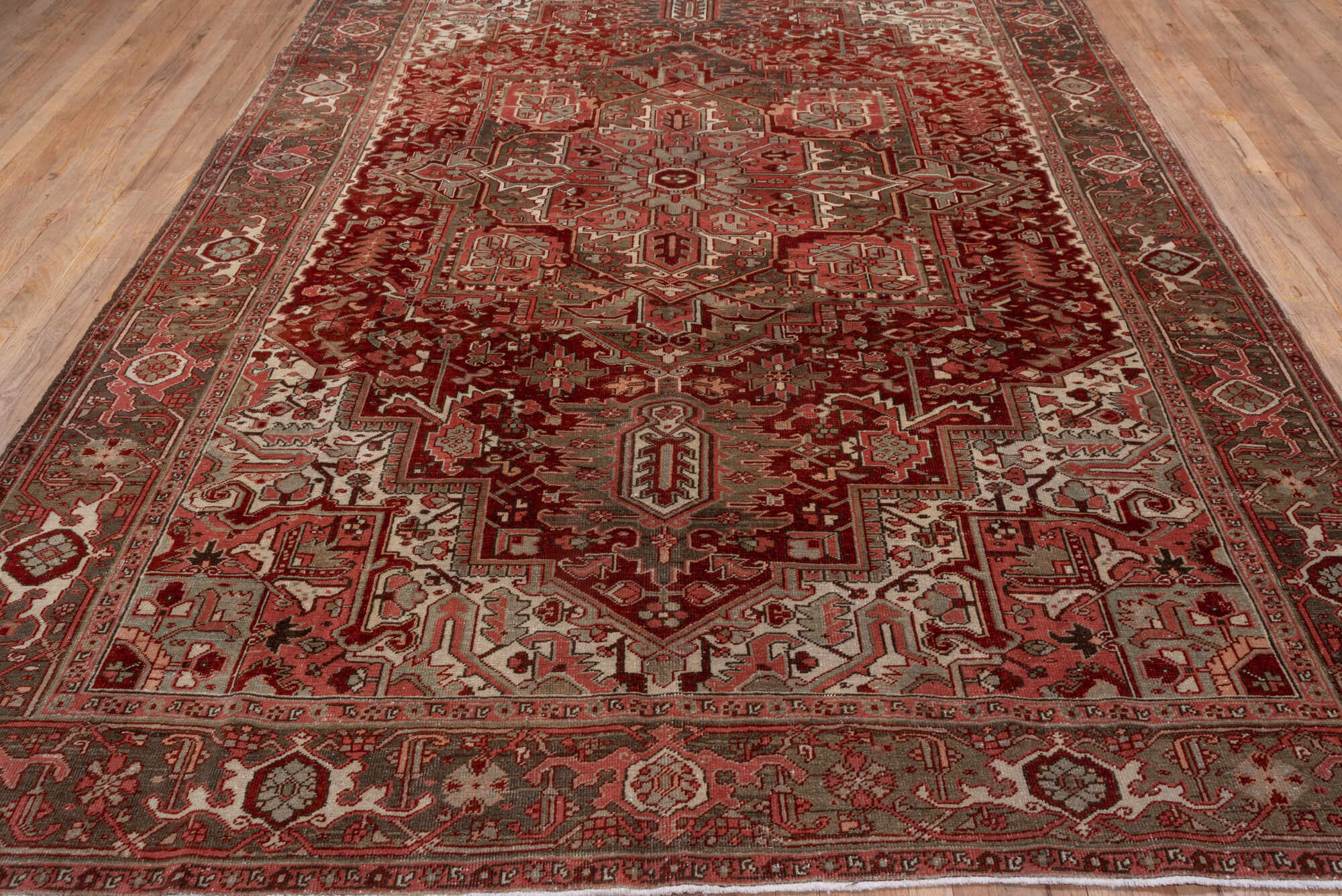 8' x 12' one-of-a-kind handmade vintage Heriz large size rug. Color palette: brown, gray, light gray, pink, red