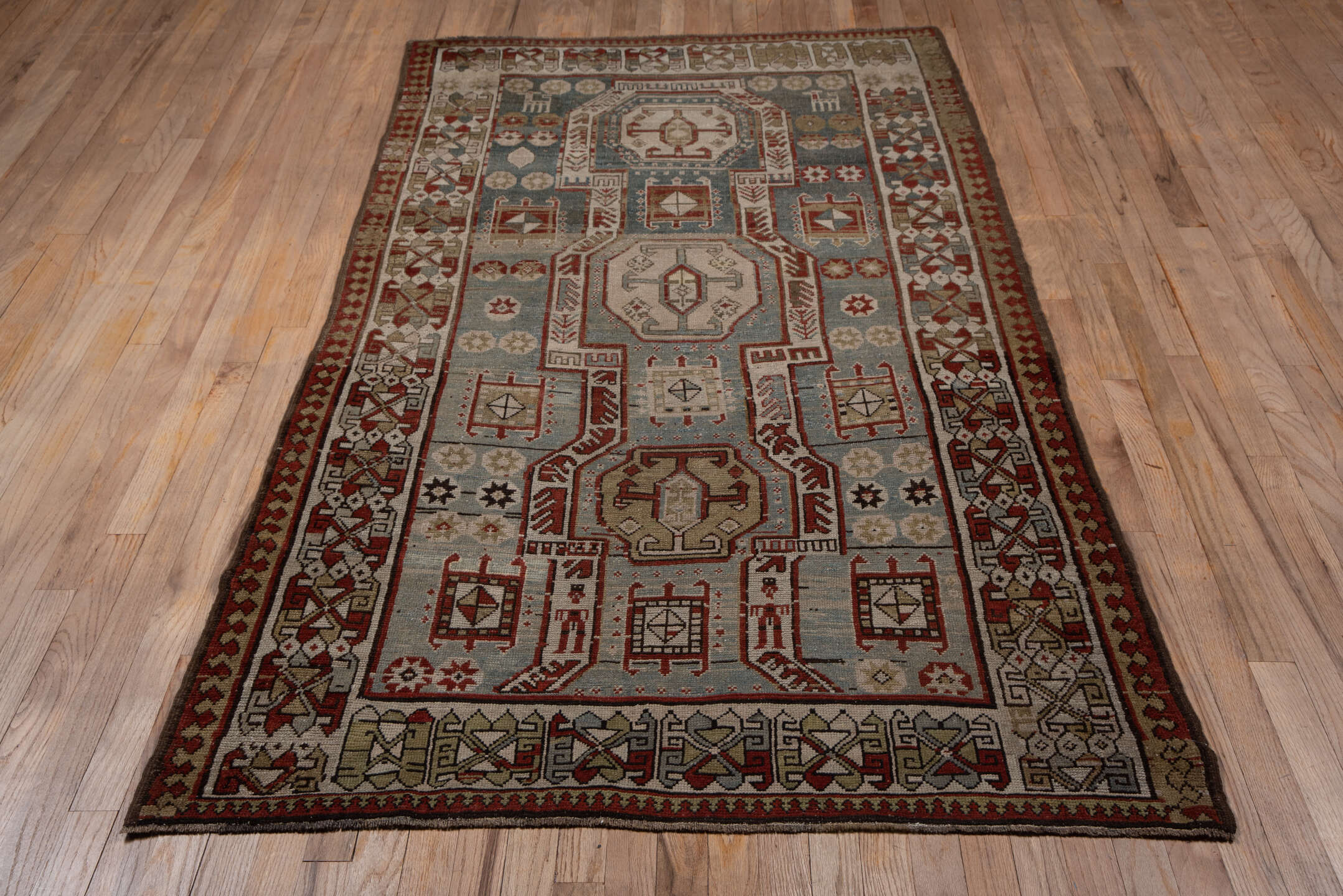 4' x 7' one-of-a-kind handmade vintage Kazak rug. Color palette: gray, black, brown, red, dim gray