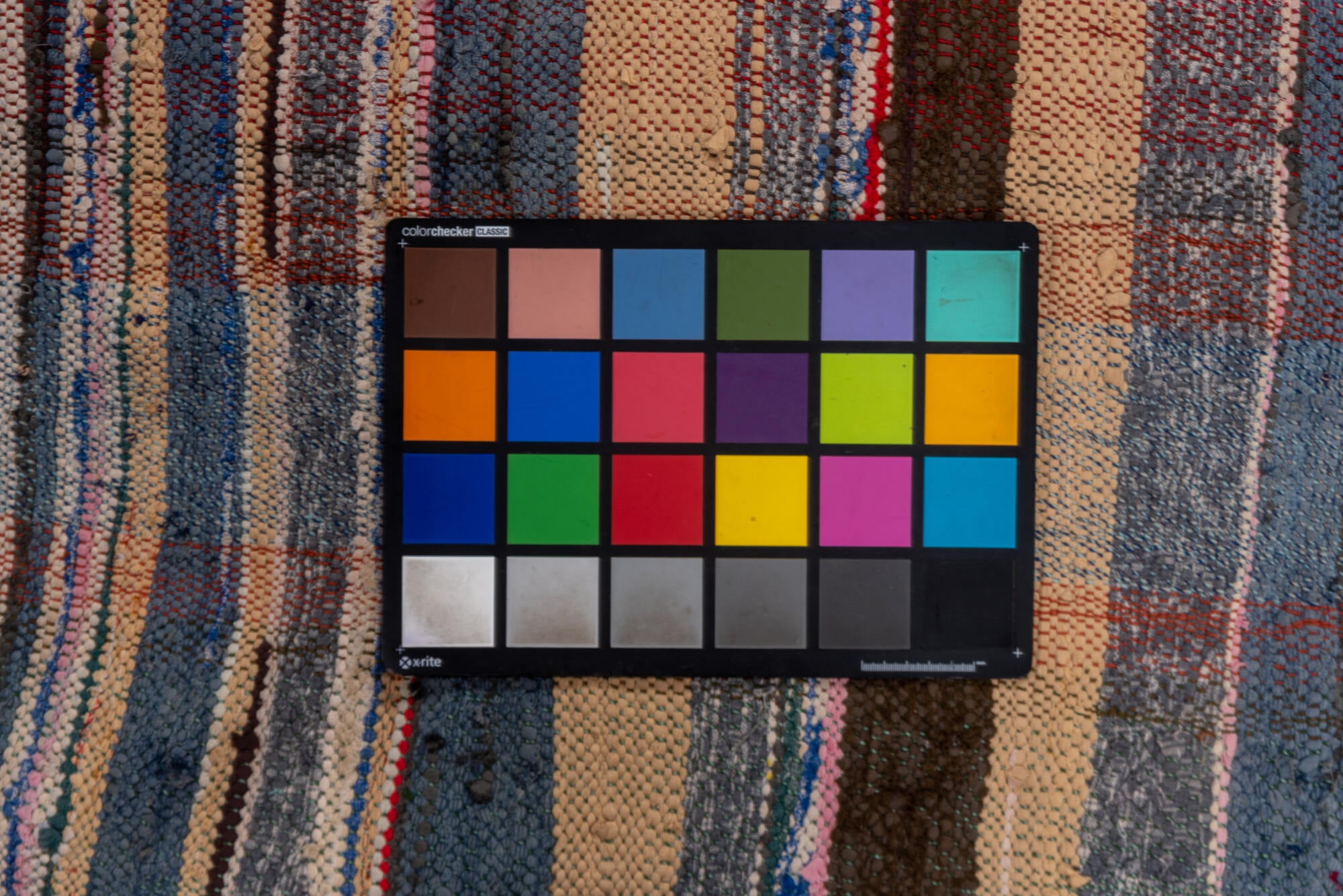 5' x 6' one-of-a-kind handmade vintage Textile rug. Color palette: blue, brown, gray, light gray, off-white, pink, red