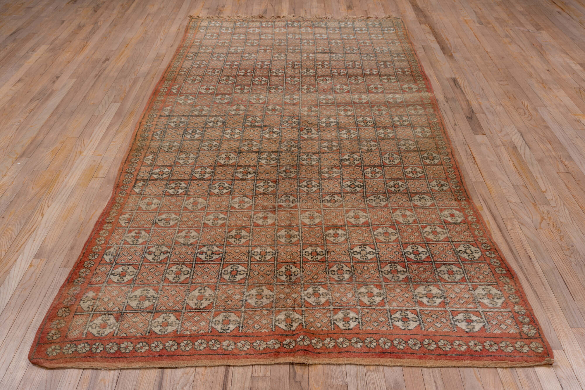 5' x 10' one-of-a-kind handmade vintage Moroccan medium size rug. Color palette: brown, gray, pink