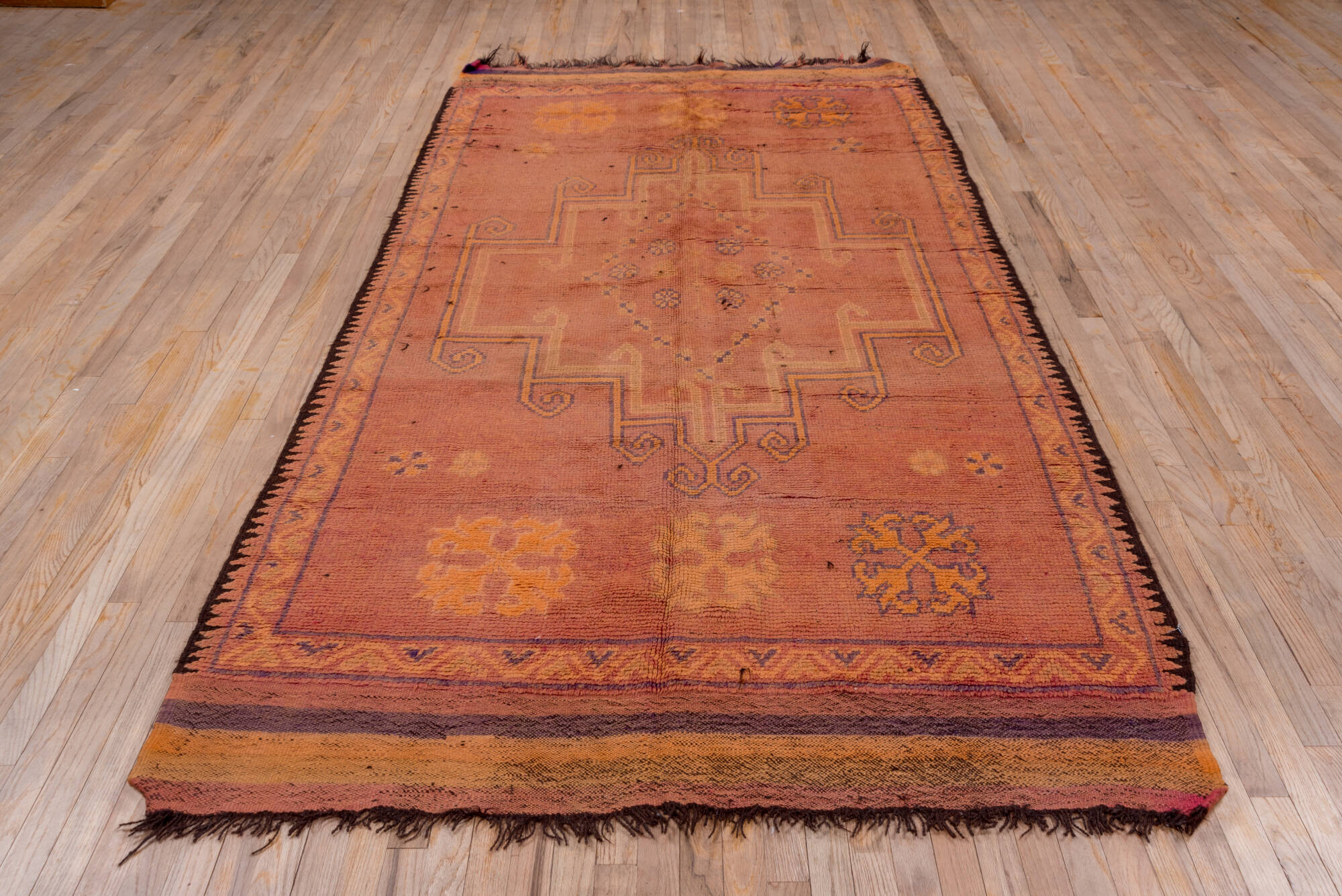 5' x 10' one-of-a-kind handmade vintage Moroccan medium size rug. Color palette: brown, gray, light gray, off-white, pink
