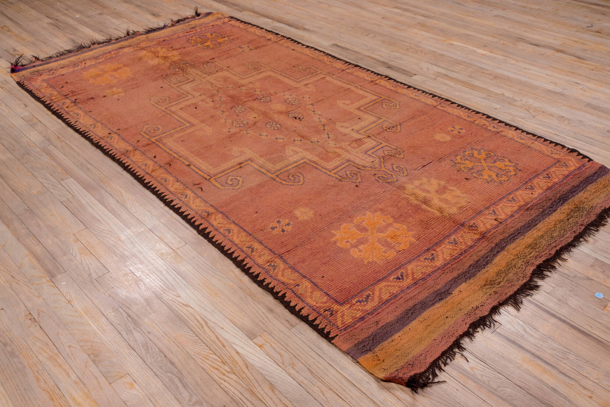 5' x 10' one-of-a-kind handmade vintage Moroccan medium size rug. Color palette: brown, gray, light gray, off-white, pink