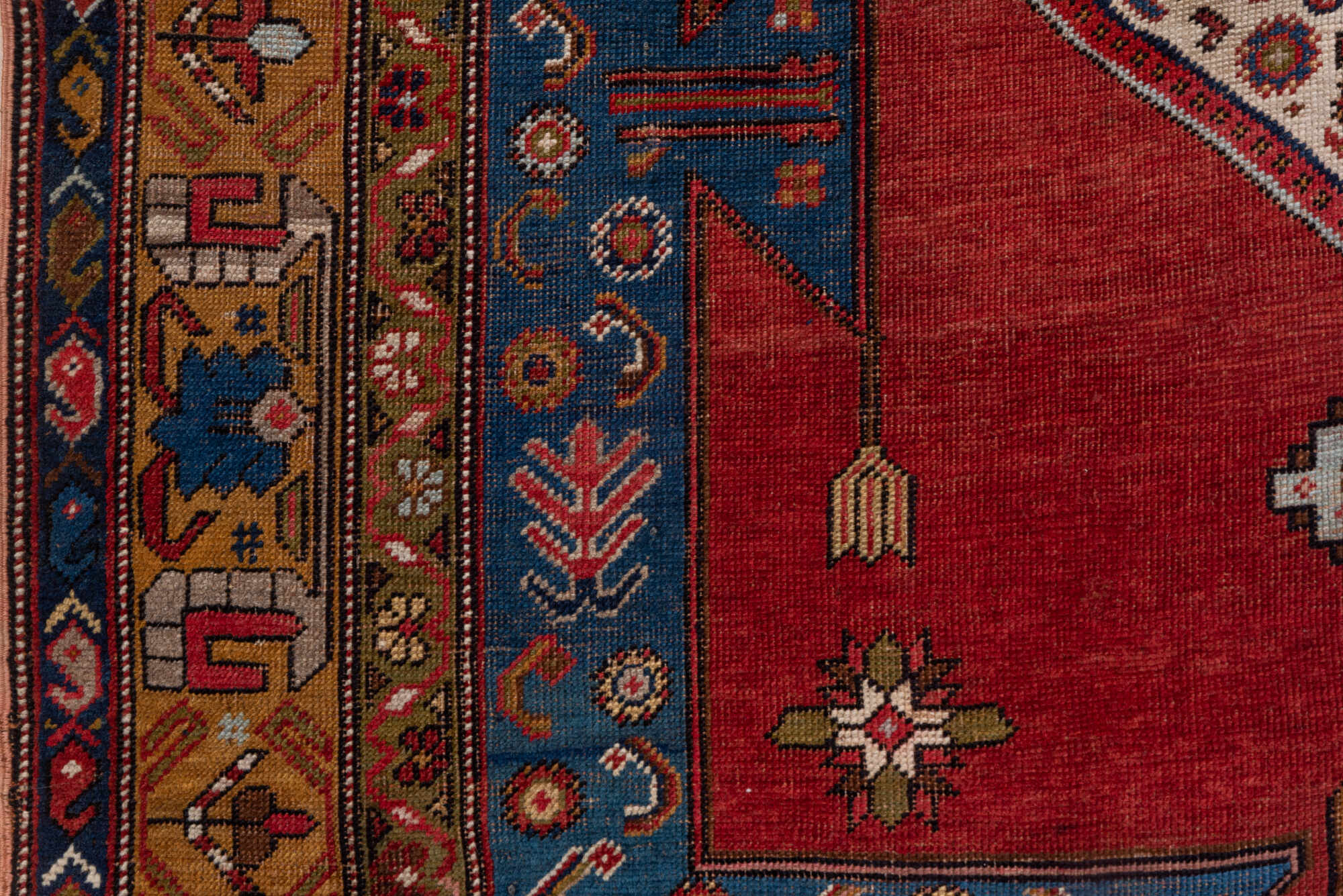 5' x 6' one-of-a-kind handmade vintage Caucasian rug. Color palette: blue, brown, gray, pink, red