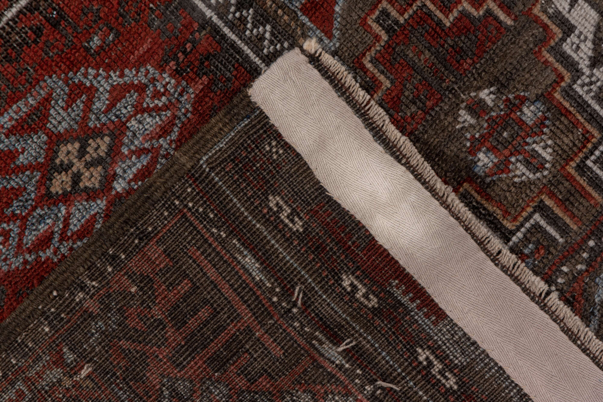 3' x 6' one-of-a-kind handmade vintage Belouch small size rug. Color palette: brown, gray, pink, red, redwood