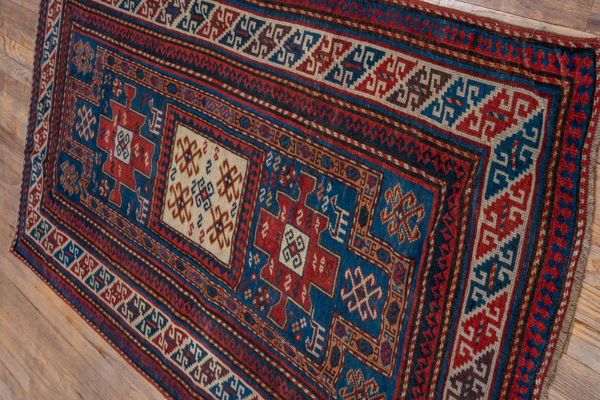 3' x 6' one-of-a-kind handmade vintage Kazak runner rug. Color palette: arapawa, blue, brown, gray, light gray, pink, red