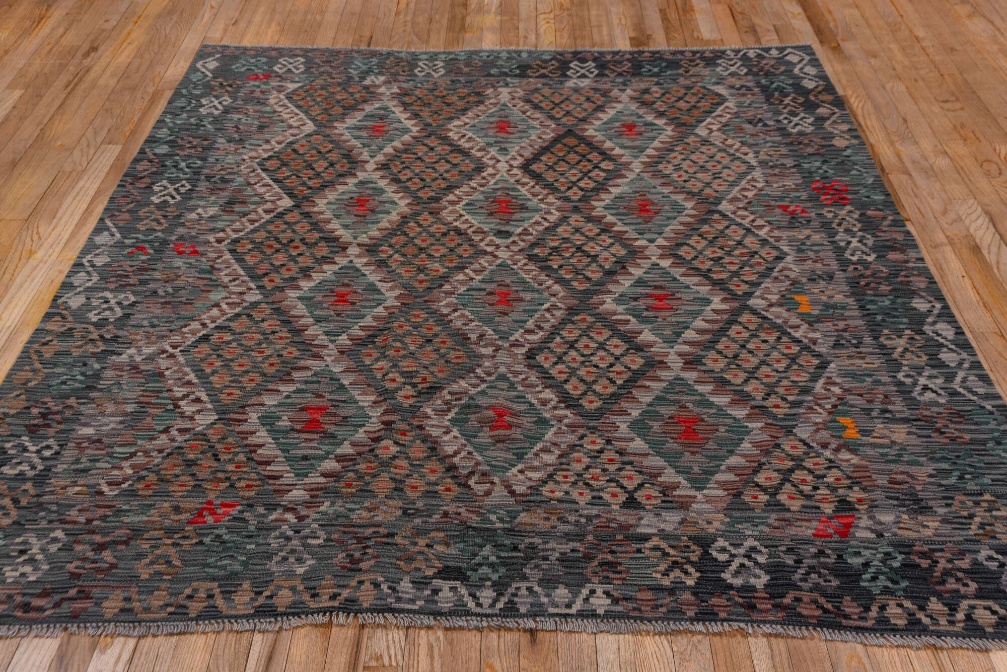 6' x 7' one-of-a-kind handmade vintage Kilim rug. Color palette: black, brown, burgundy, charcoal, dim gray, gray, pink, red