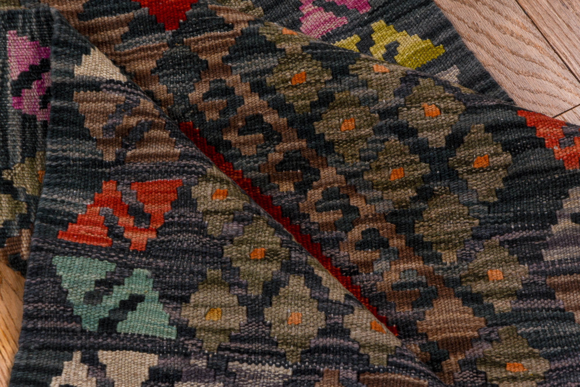 2' x 9' one-of-a-kind handmade vintage Kilim runner rug. Color palette: black, blue, brown, gray, pink, red