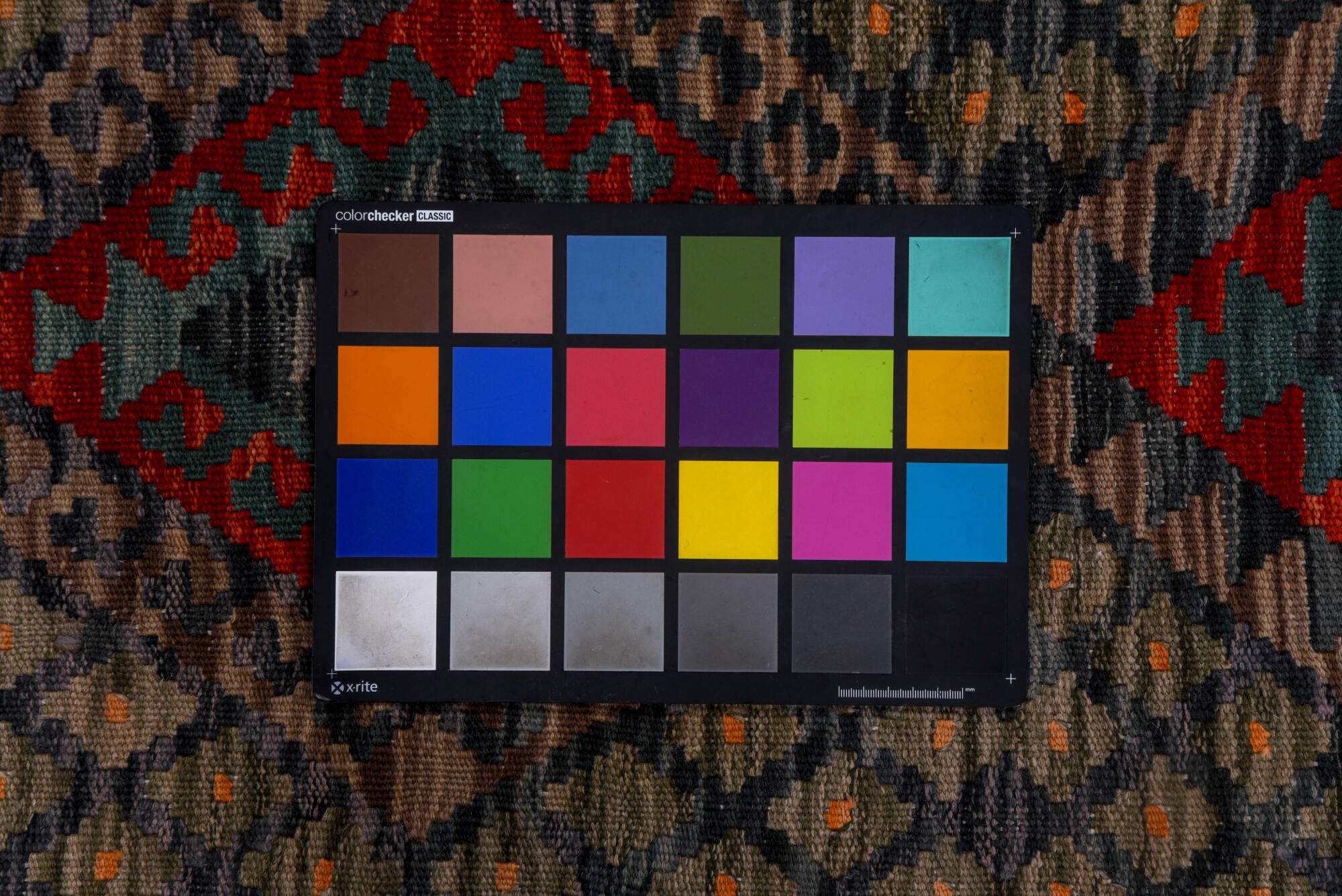 2' x 9' one-of-a-kind handmade vintage Kilim runner rug. Color palette: black, blue, brown, gray, pink, red