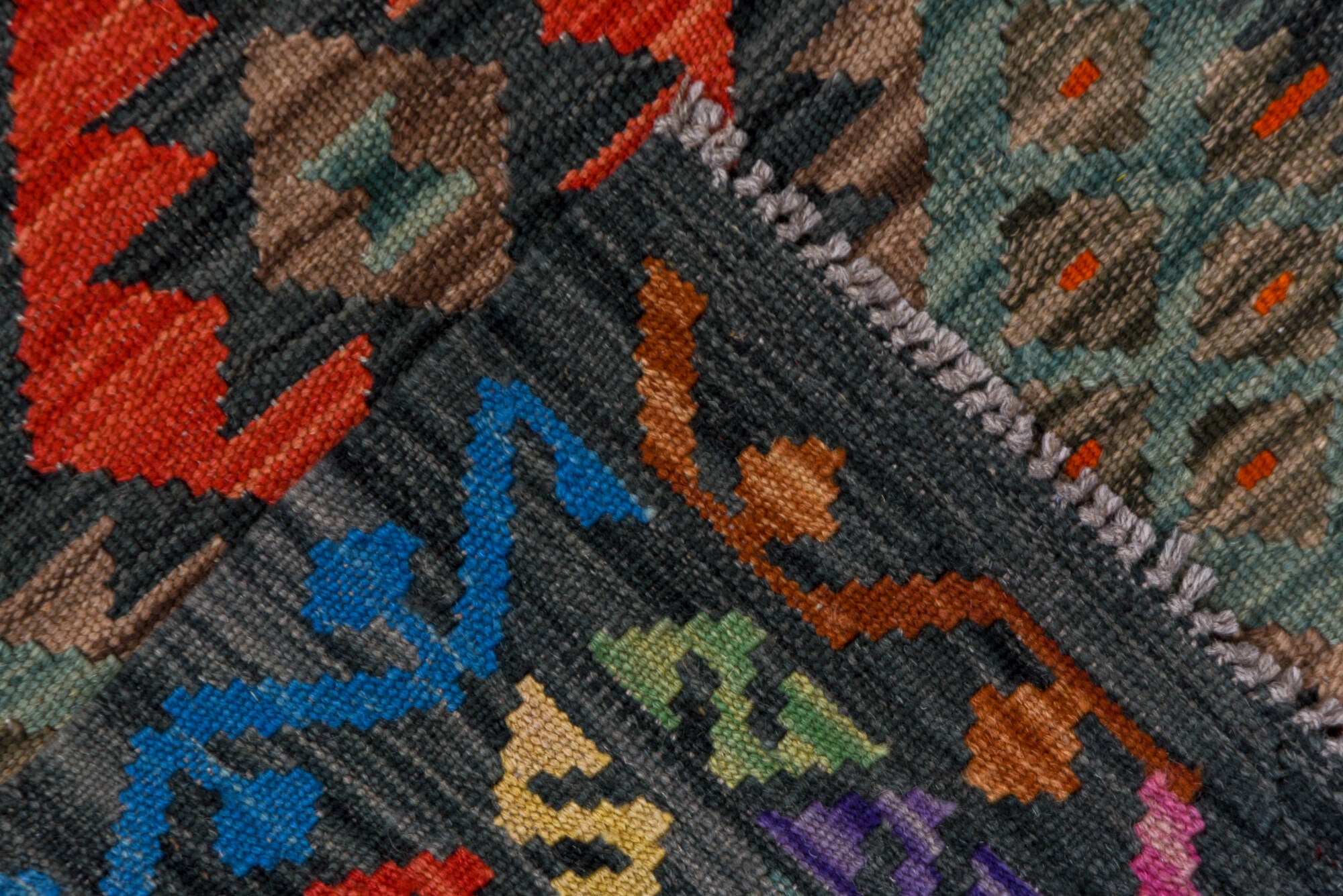 2' x 9' one-of-a-kind handmade vintage Kilim runner rug. Color palette: black, blue, brown, charcoal, gray, green, pink, red