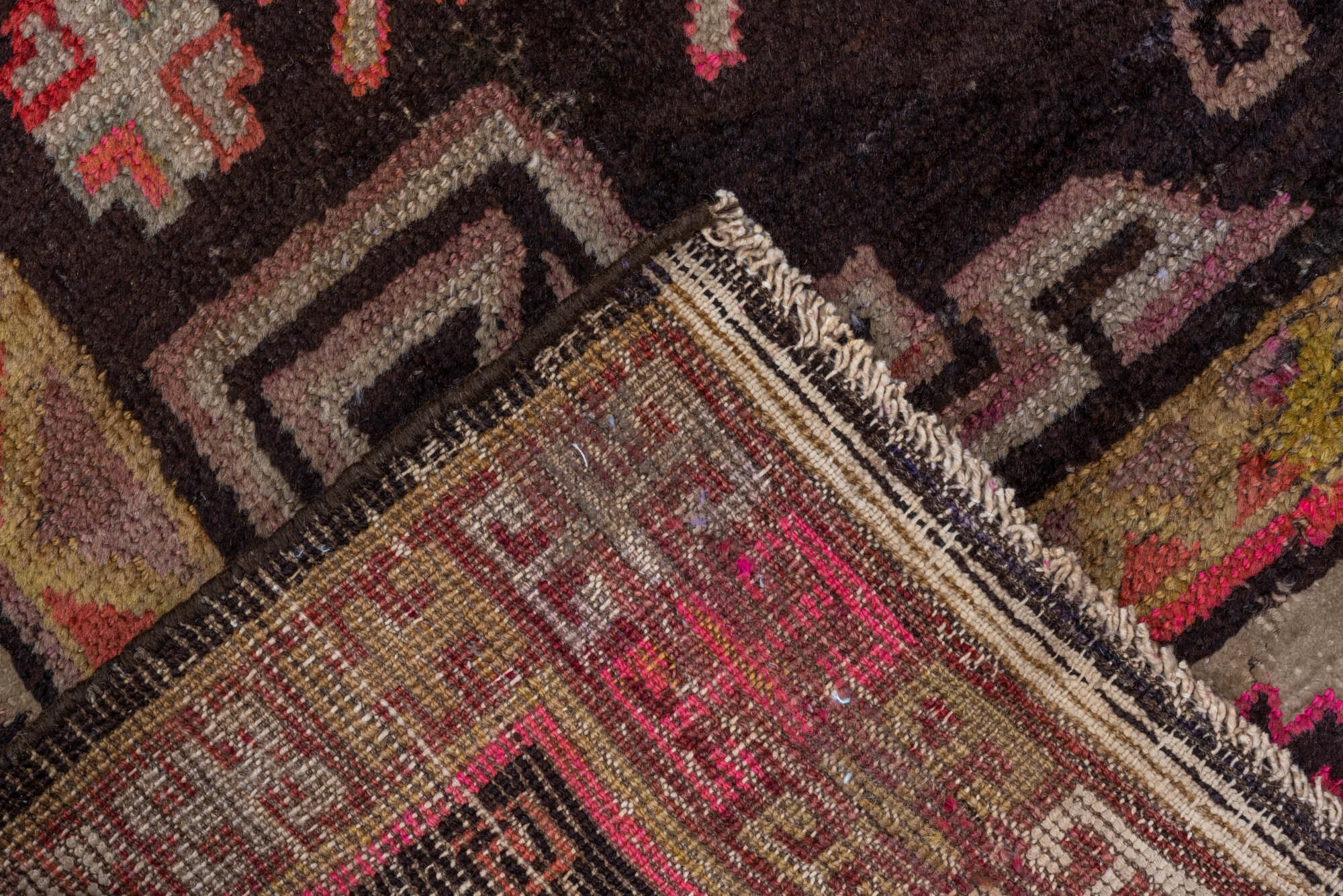 5' x 8' one-of-a-kind handmade vintage Khotan medium size rug. Color palette: black, brown, gray, pink, red
