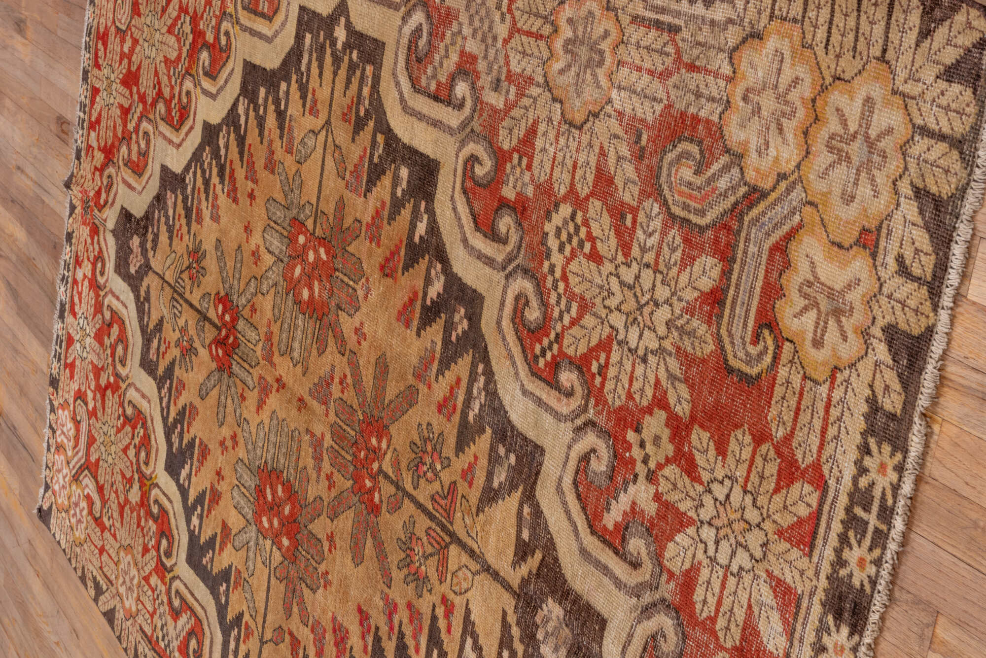 5' x 8' one-of-a-kind handmade vintage Khotan medium size rug. Color palette: brown, dark red, off-white, orange, red, tan