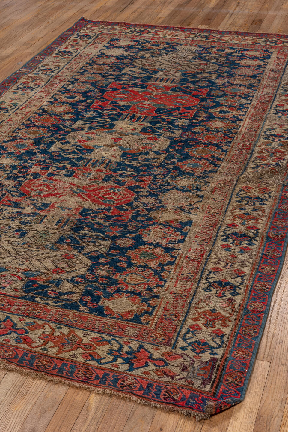 5' x 9' one-of-a-kind handmade vintage Sumak medium size rug. Color palette: brown, red, gray, black, blue, pink, charcoal