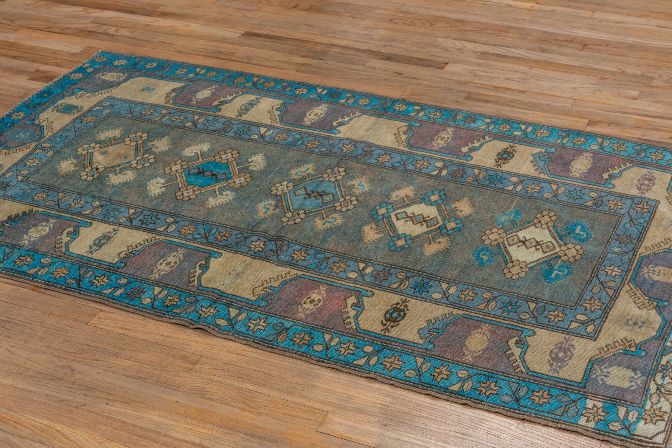 4' x 6' one-of-a-kind handmade vintage Anatol small size rug. Color palette: black, brown, blue, green, gray
