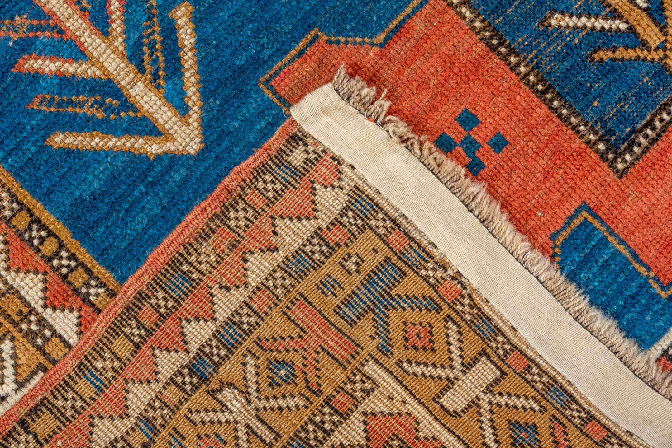 4' x 5' one-of-a-kind handmade vintage Kazak small size rug. Color palette: red, orange, brown, gray, blue, pink, off-white