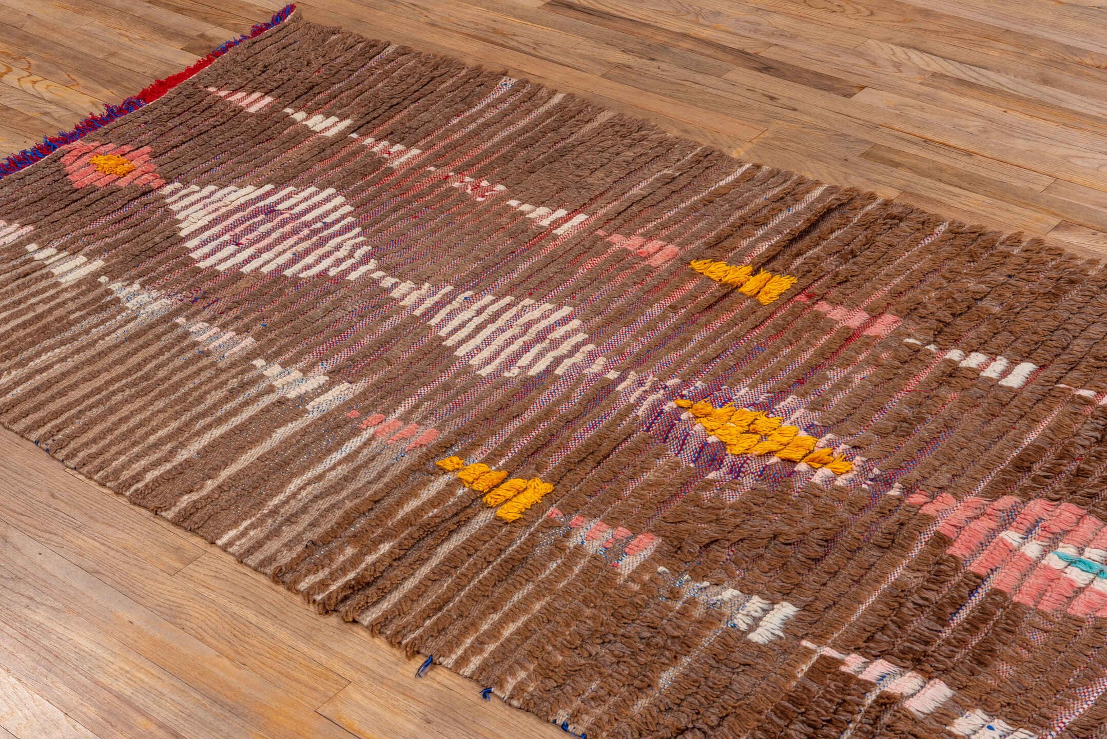 3' x 7' one-of-a-kind handmade vintage Moroccan rug. Color palette: pink, gray, light gray, brown, orange, off-white, blue